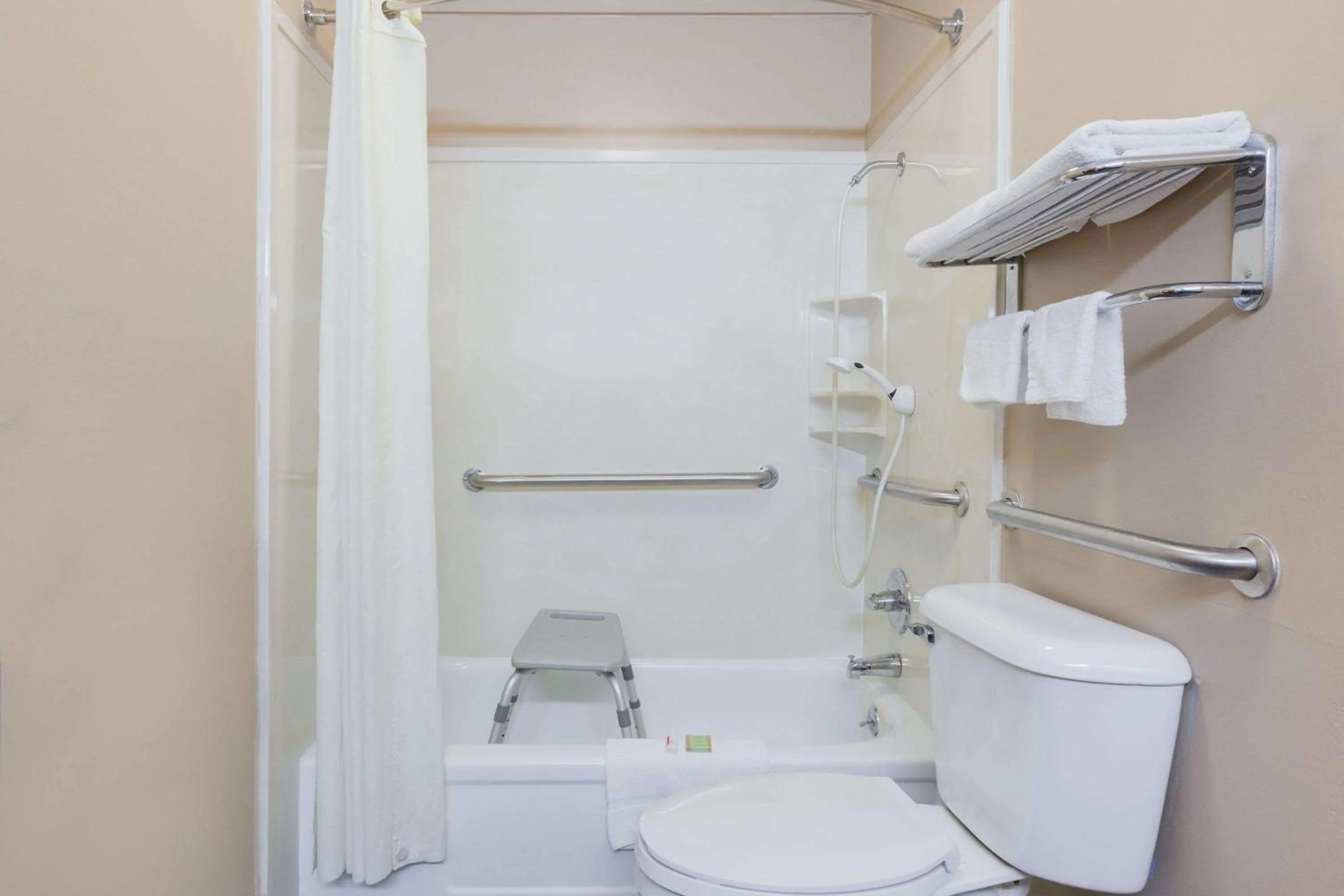 Toilet in Super 8 by Wyndham Mt. Pleasant TX