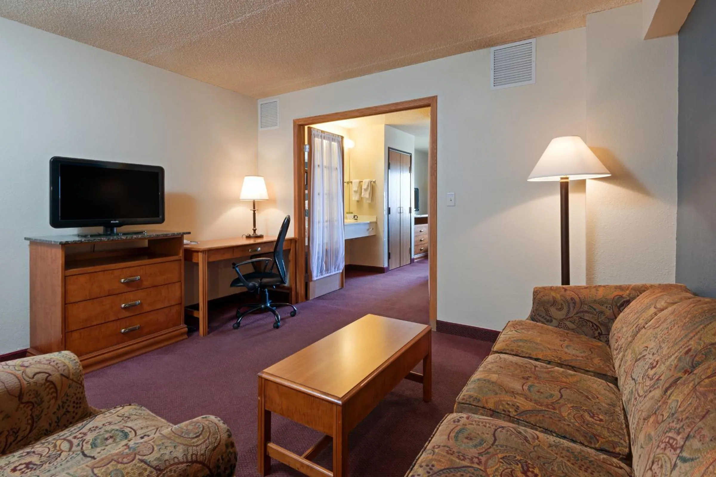 Living room in AmericInn by Wyndham Rexburg BYUI