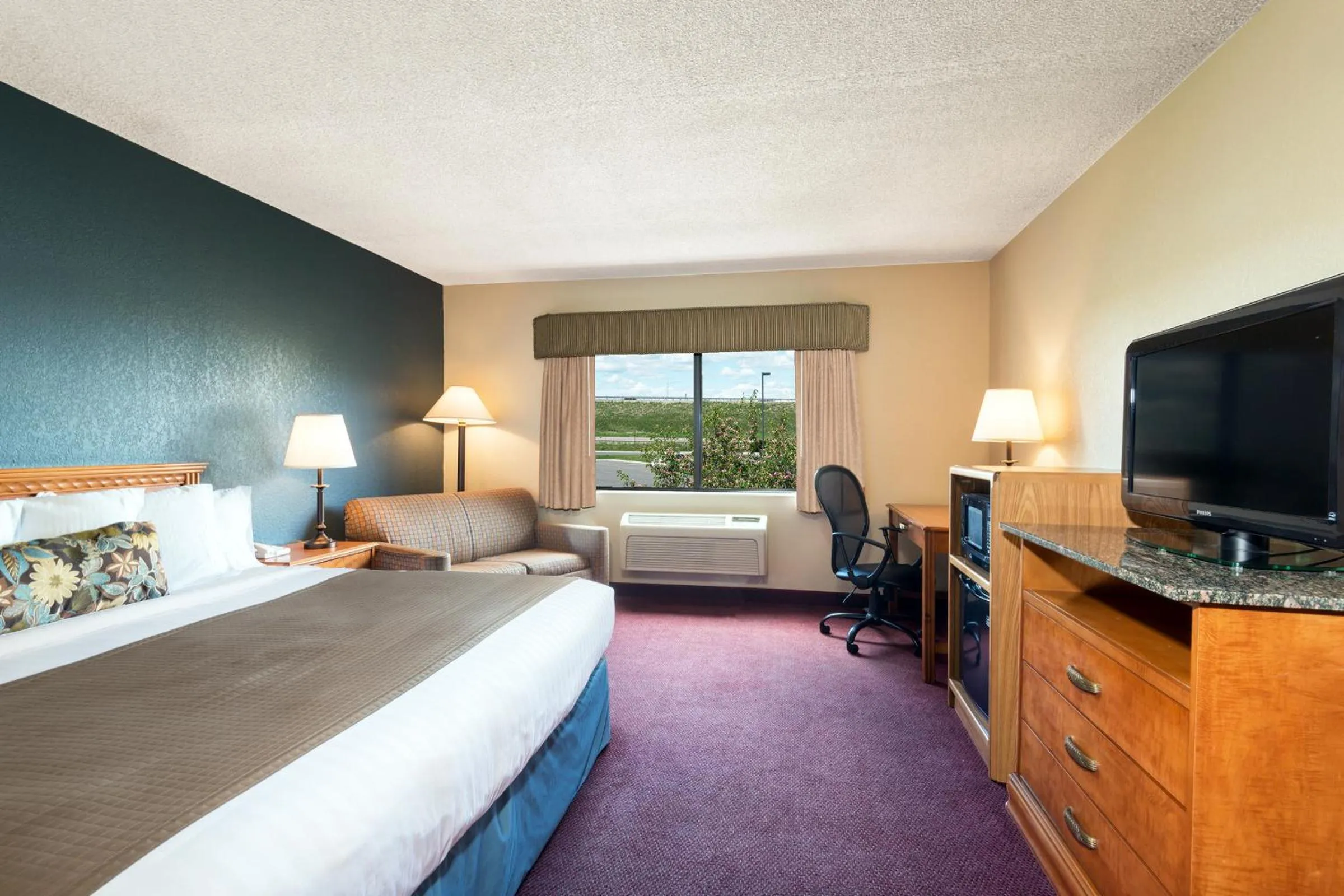 Photo of the whole room, Bed in AmericInn by Wyndham Rexburg BYUI