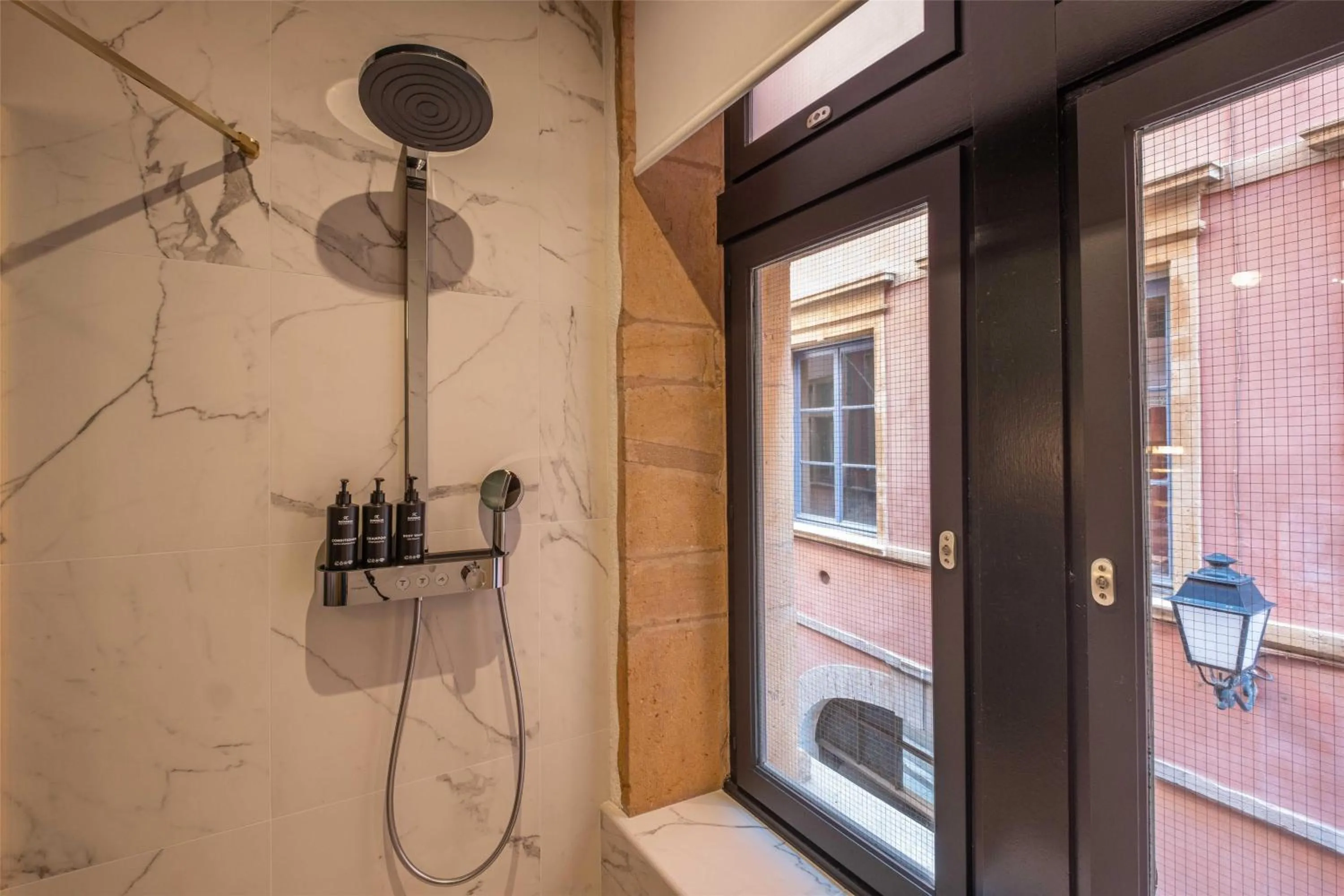 Bathroom in Cour des Loges Lyon, A Radisson Collection Hotel