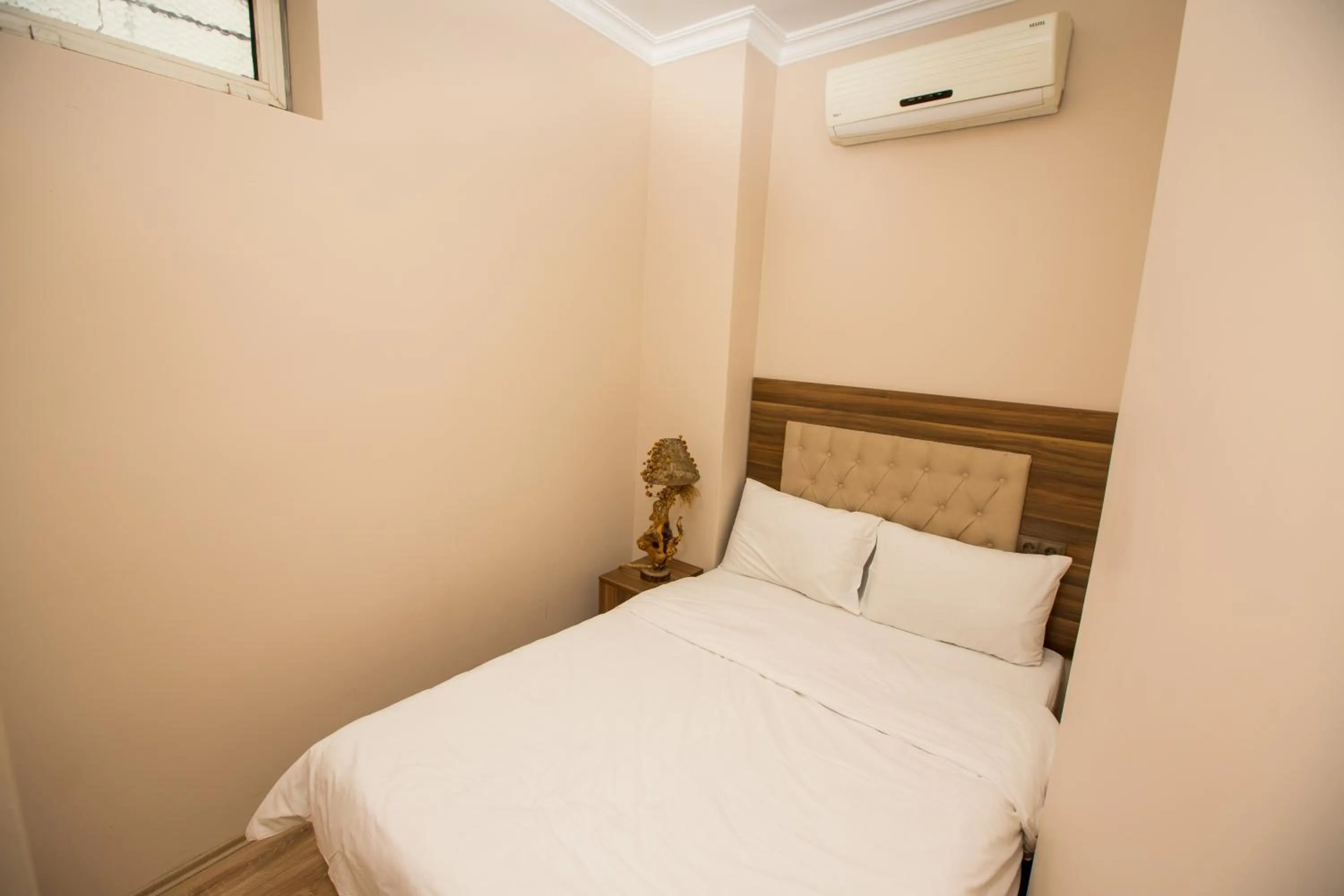 Bed in Corner Garden Hotel