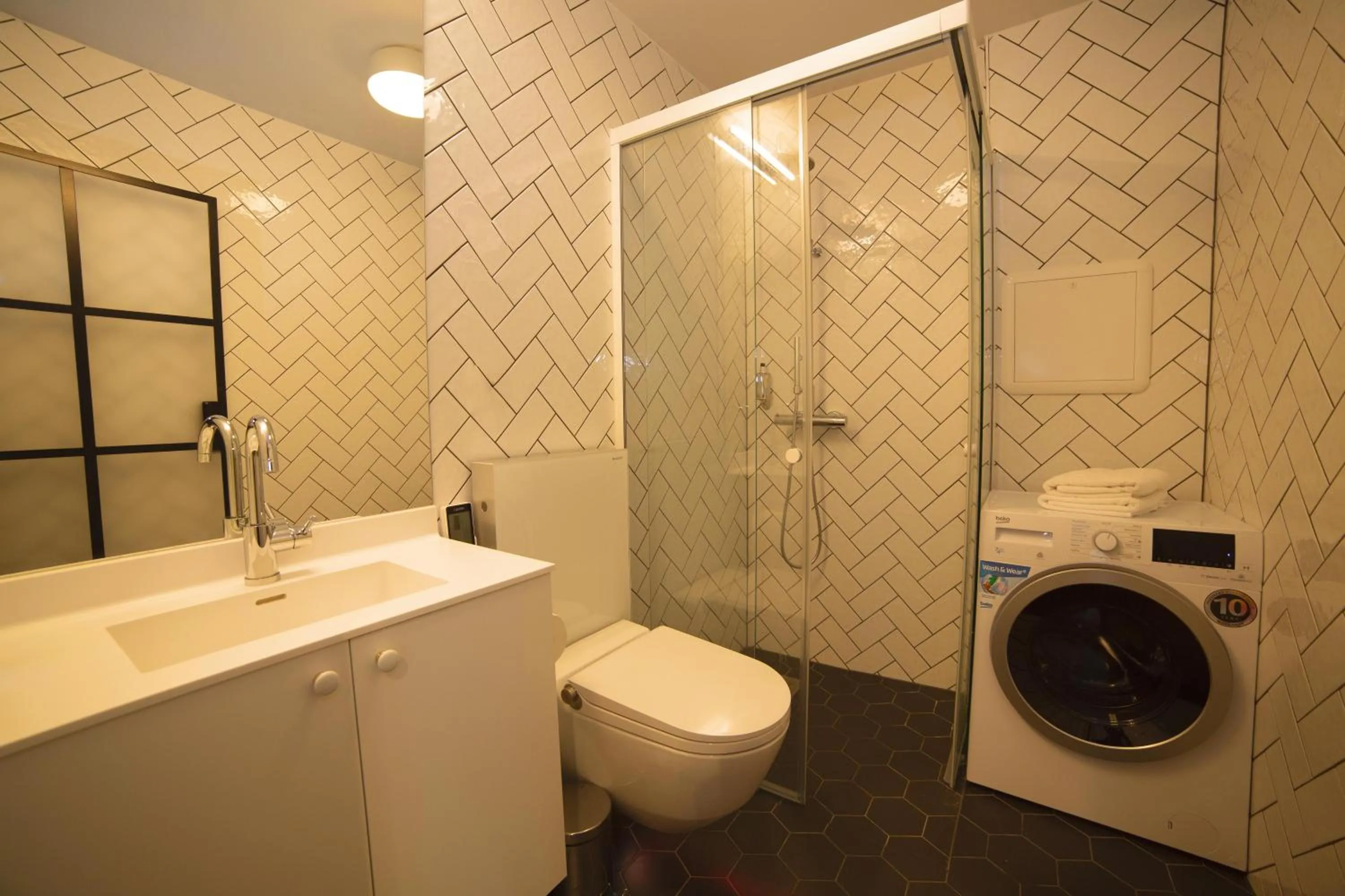 Bathroom in Home Again Apartments Kirkegata