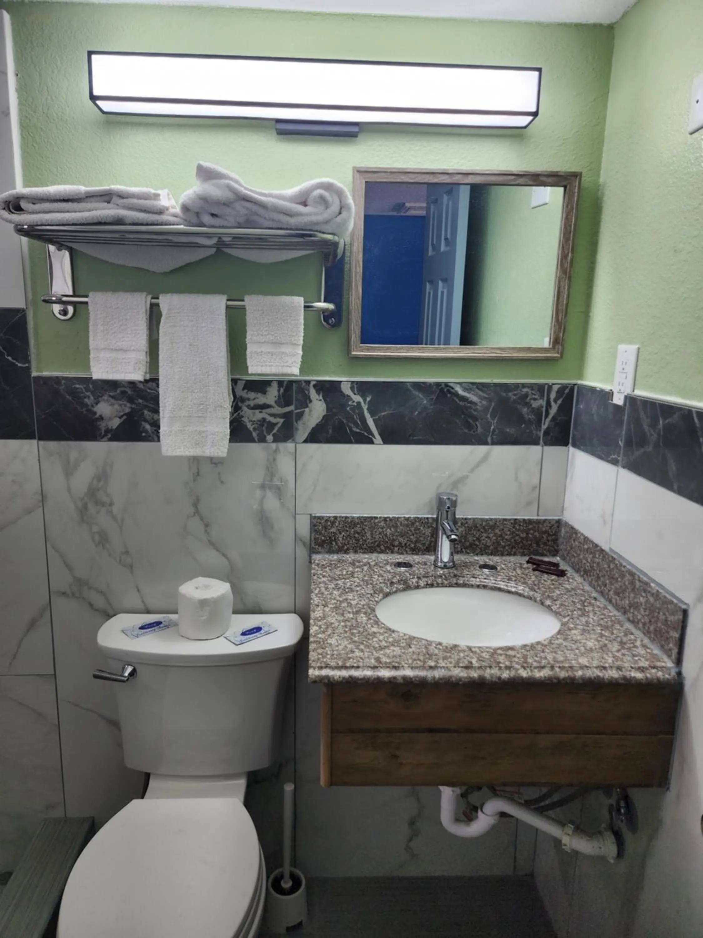 Toilet in Plaza Motel