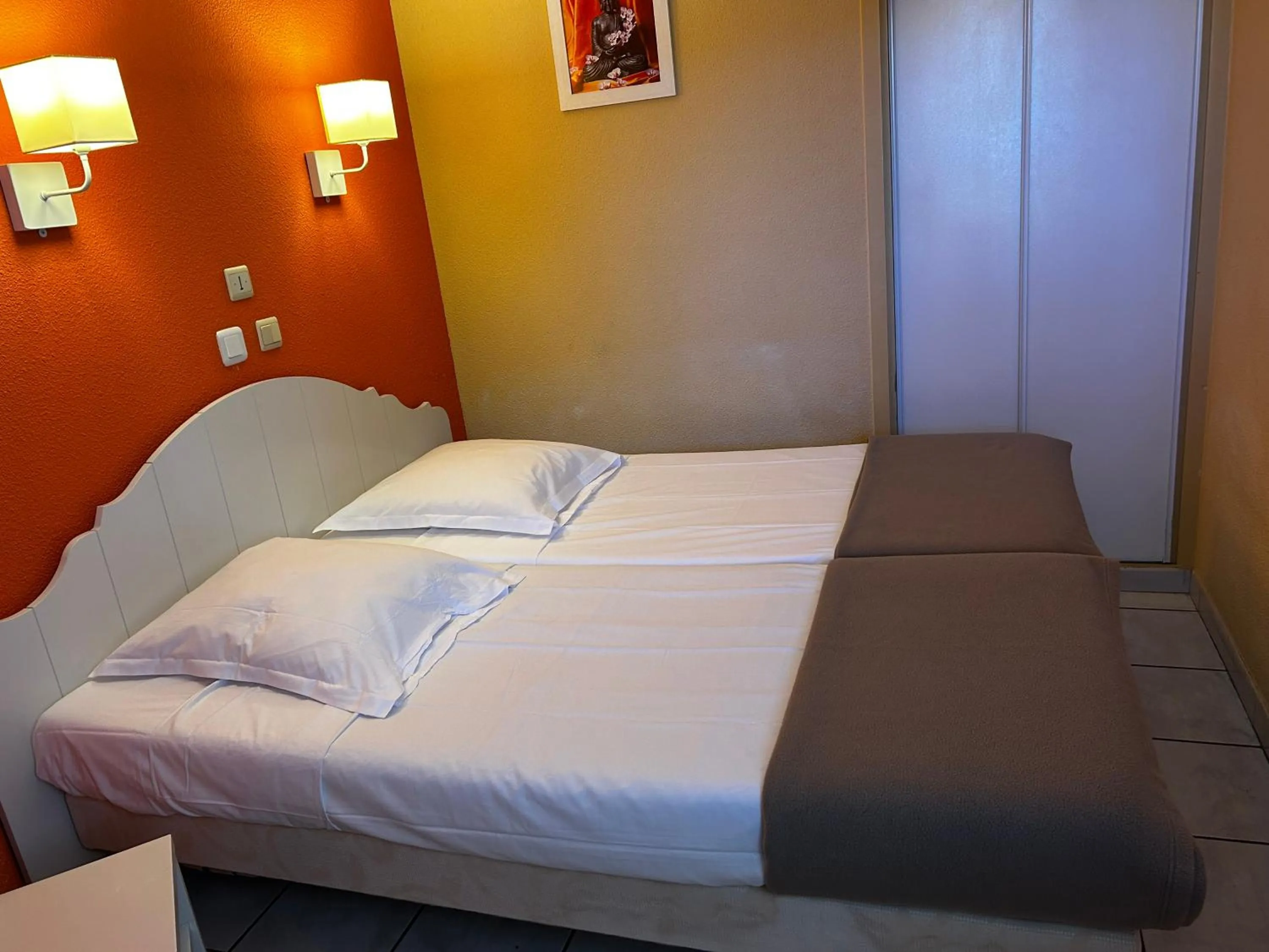 Bed in Lagrange Grand Bleu Vacances – Résidence Les Jardins de Neptune