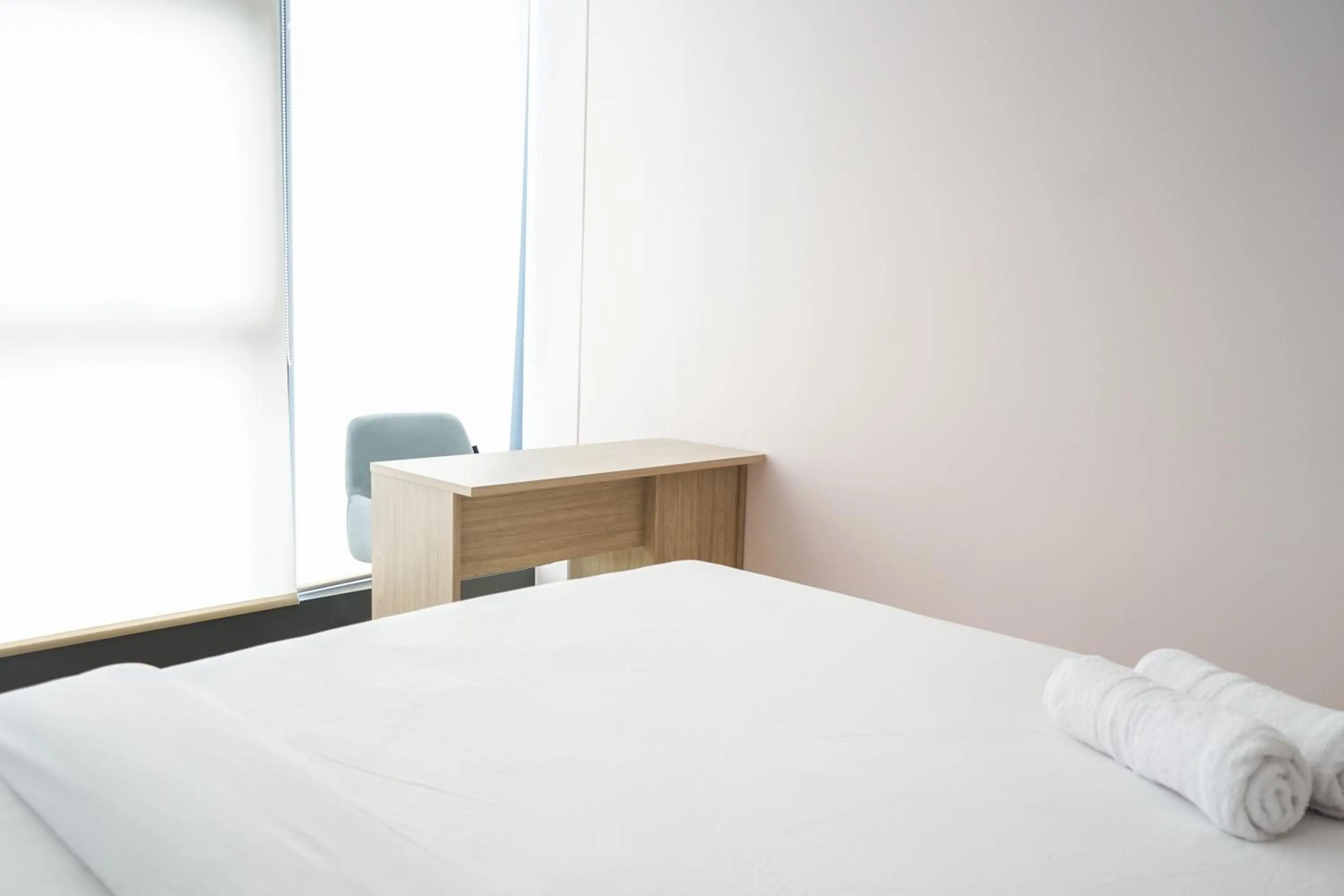 Bed in South Tower 2BR at L'Avenue Apartment By Travelio