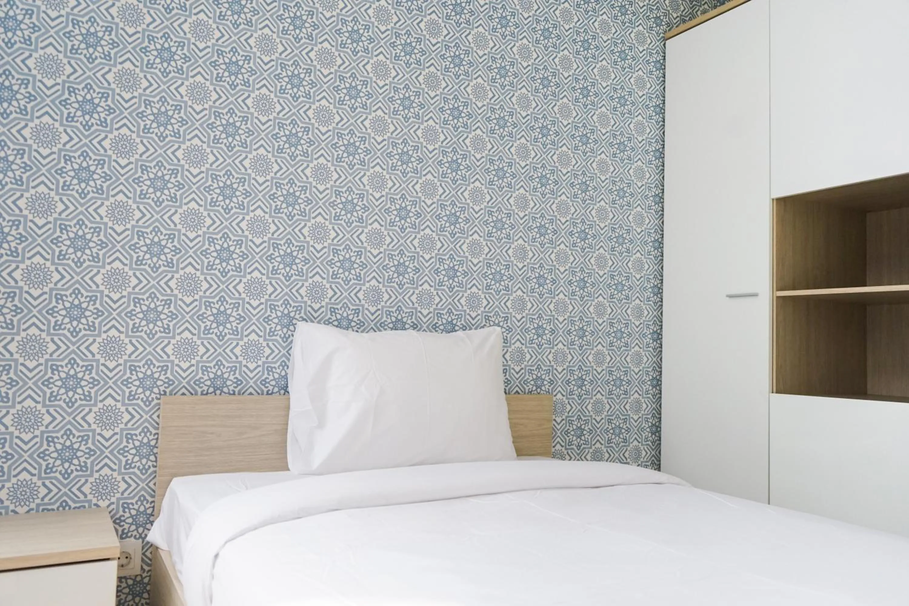 Bed in South Tower 2BR at L'Avenue Apartment By Travelio