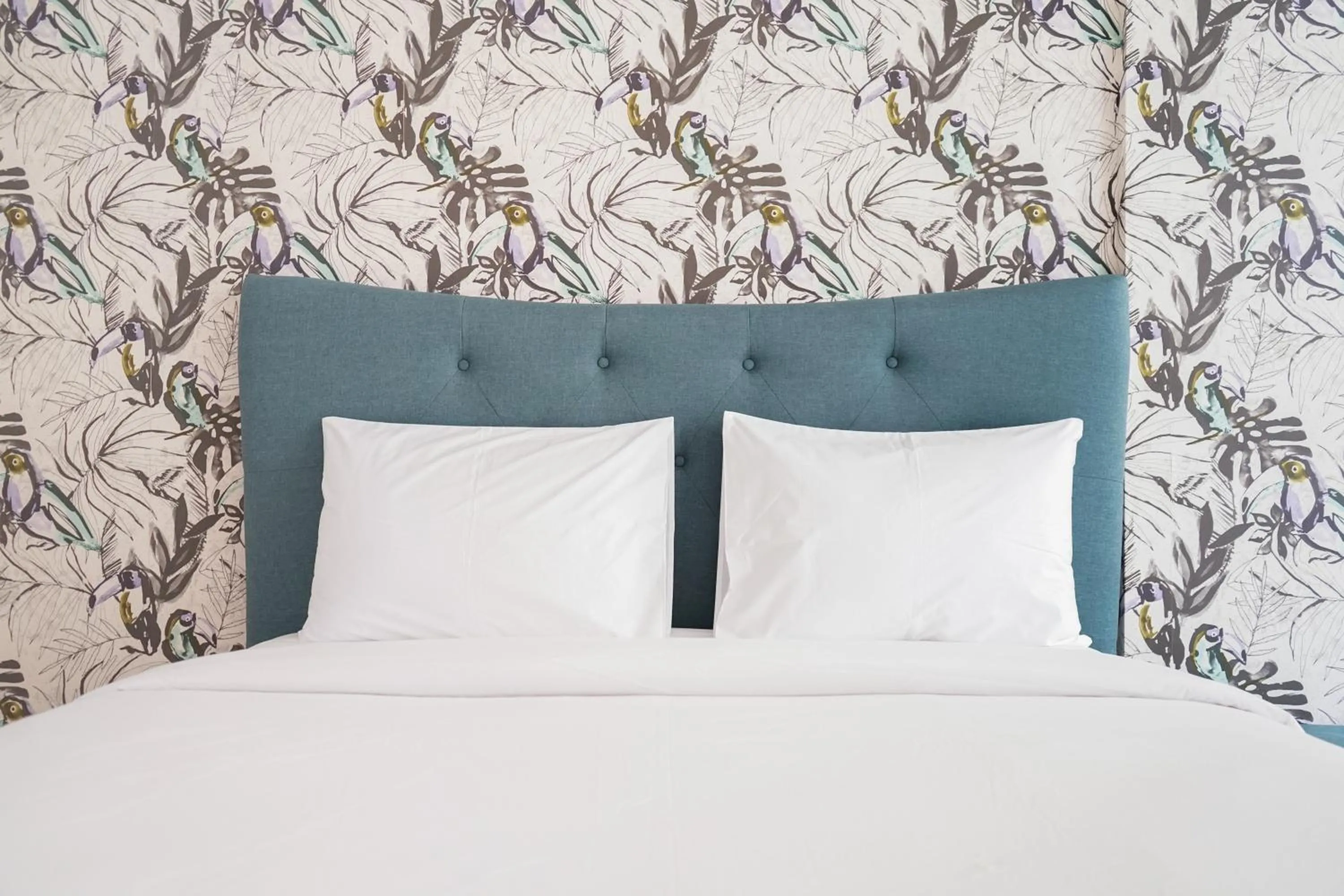 Bed in South Tower 2BR at L'Avenue Apartment By Travelio