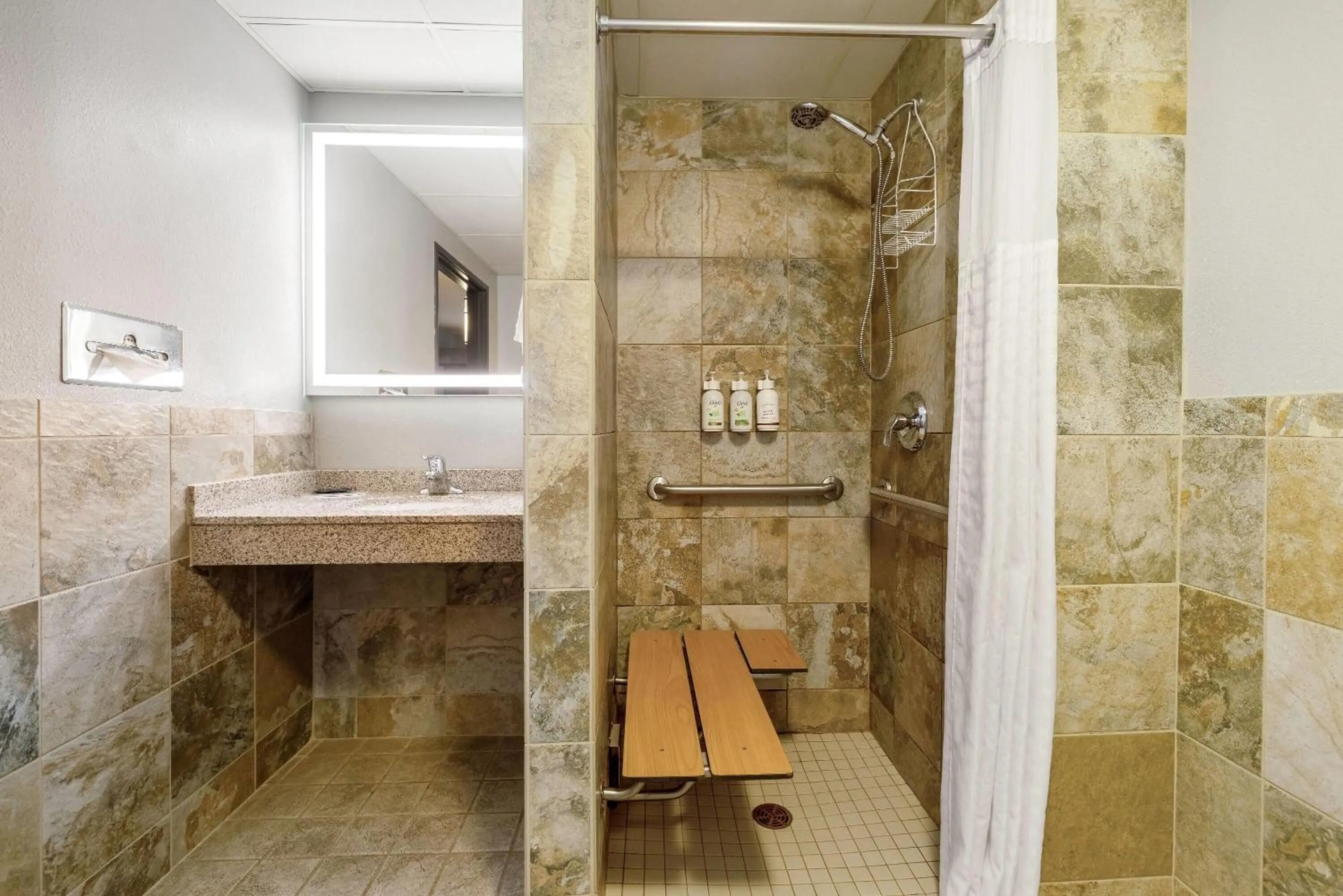 Shower in AmericInn by Wyndham Chamberlain Conference Center