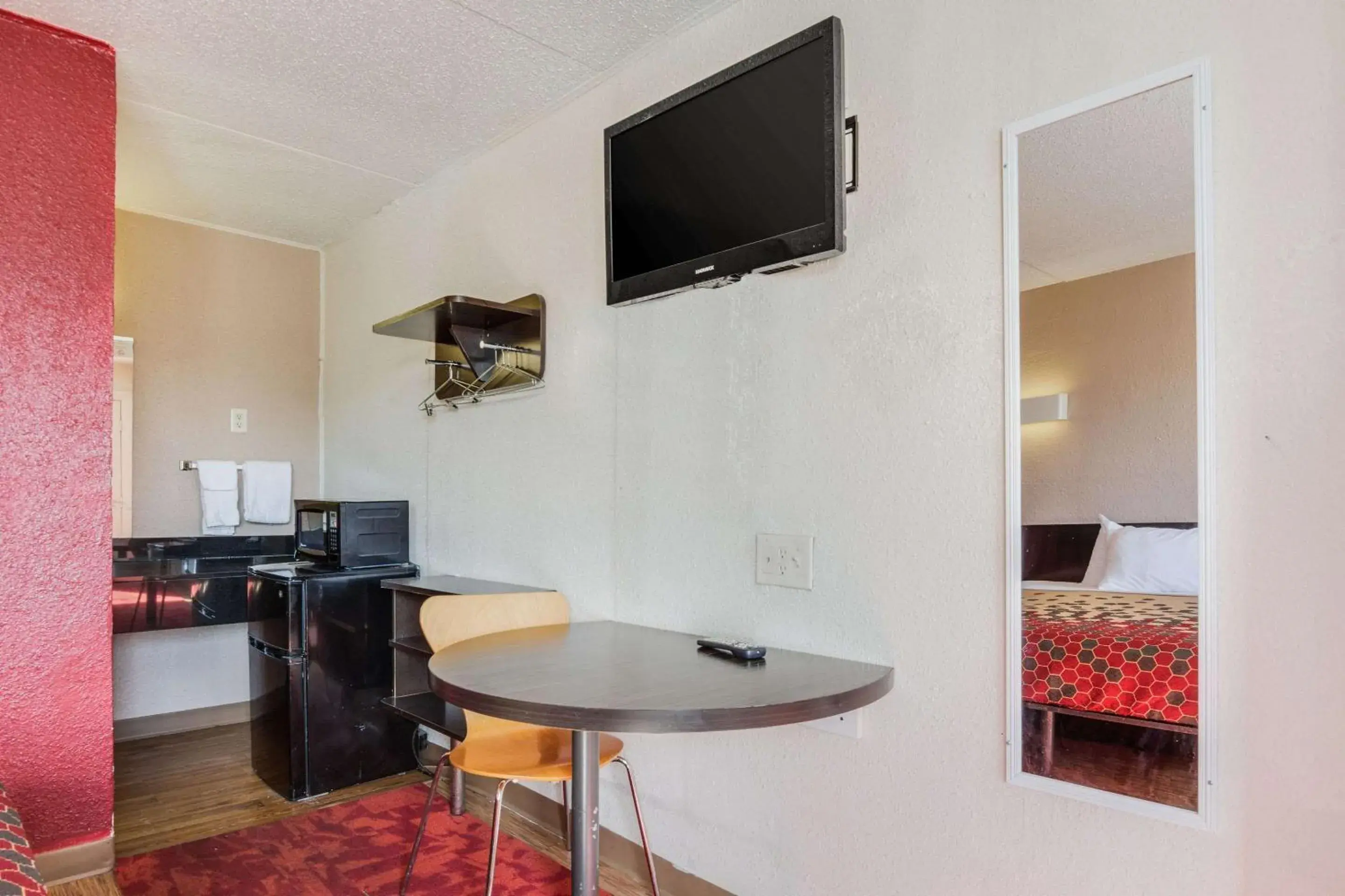 Photo of the whole room, TV/Entertainment Center in Econo Lodge Inn & Suites