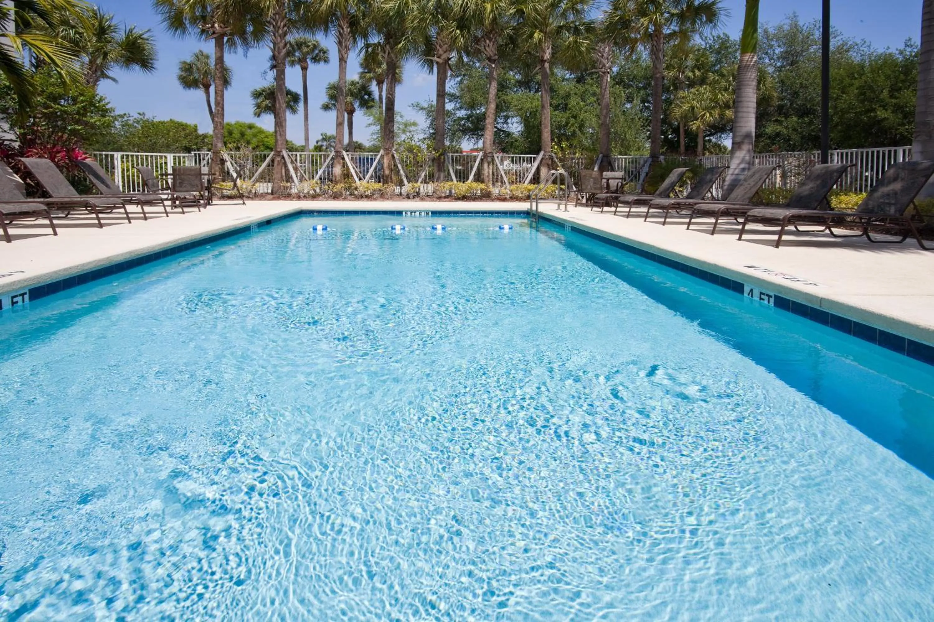 Swimming pool in Holiday Inn Express West Palm Beach Metrocentre by IHG