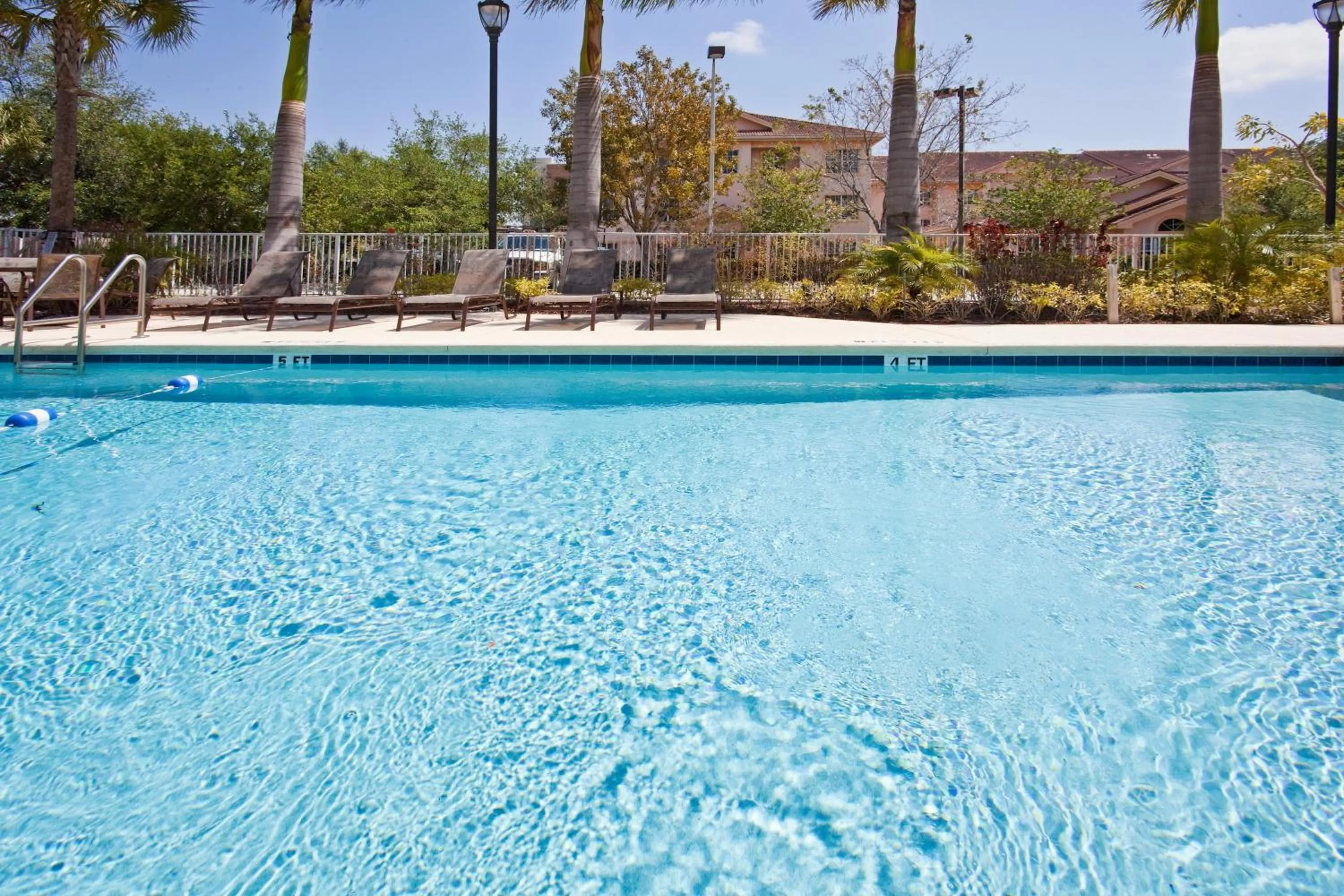 Swimming pool in Holiday Inn Express West Palm Beach Metrocentre by IHG
