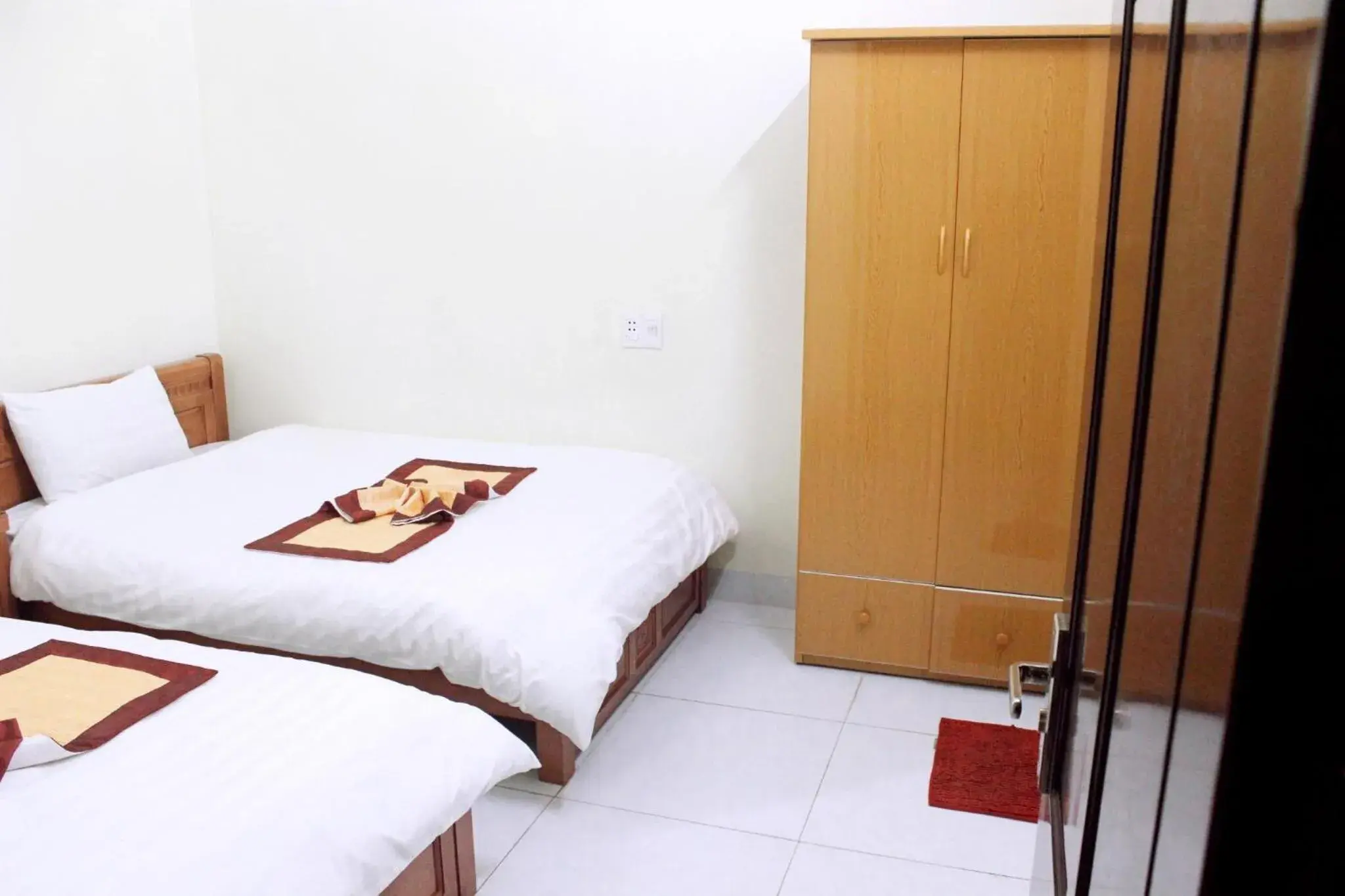 Bed in Duc Thang Guest House (Nhà Nghỉ Đức Thắng) Bed in Duc Thang Guest House (Nhà Nghỉ Đức Thắng)