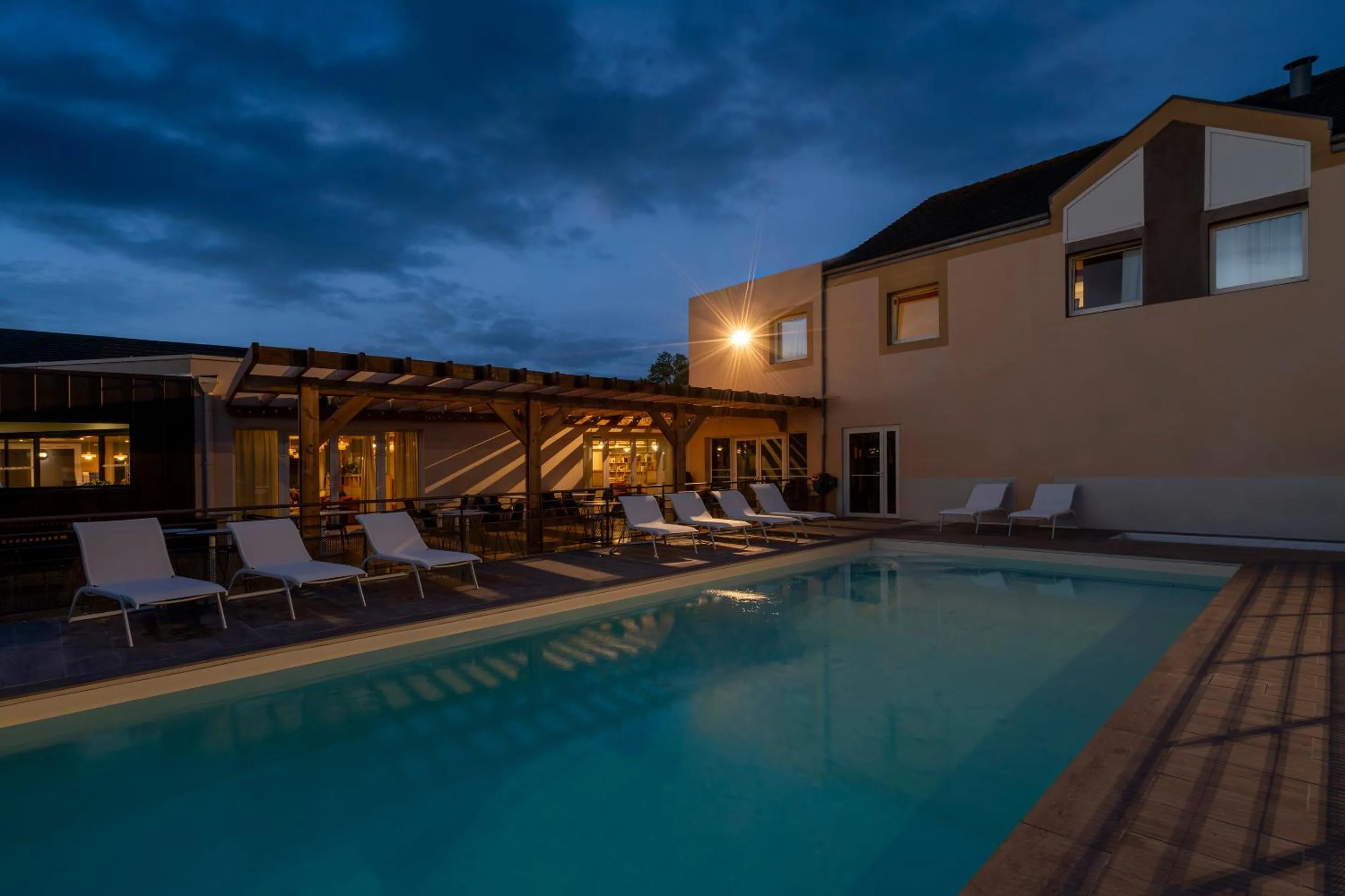 Swimming pool in Sure Hotel by Best Western Caen Memorial