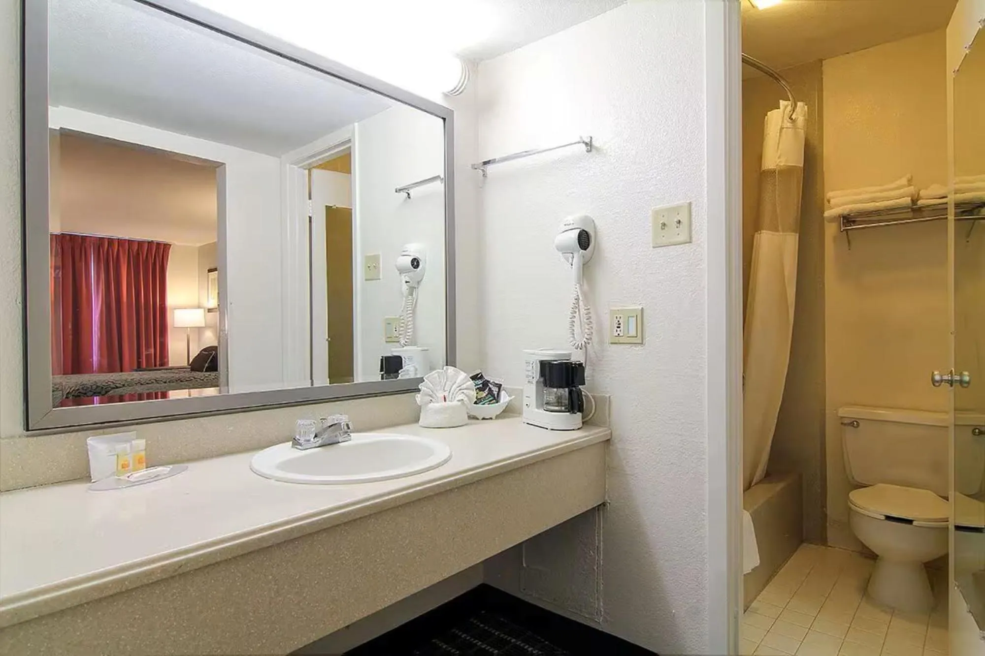 Bathroom in Days Inn by Wyndham Market Center Dallas Love Field