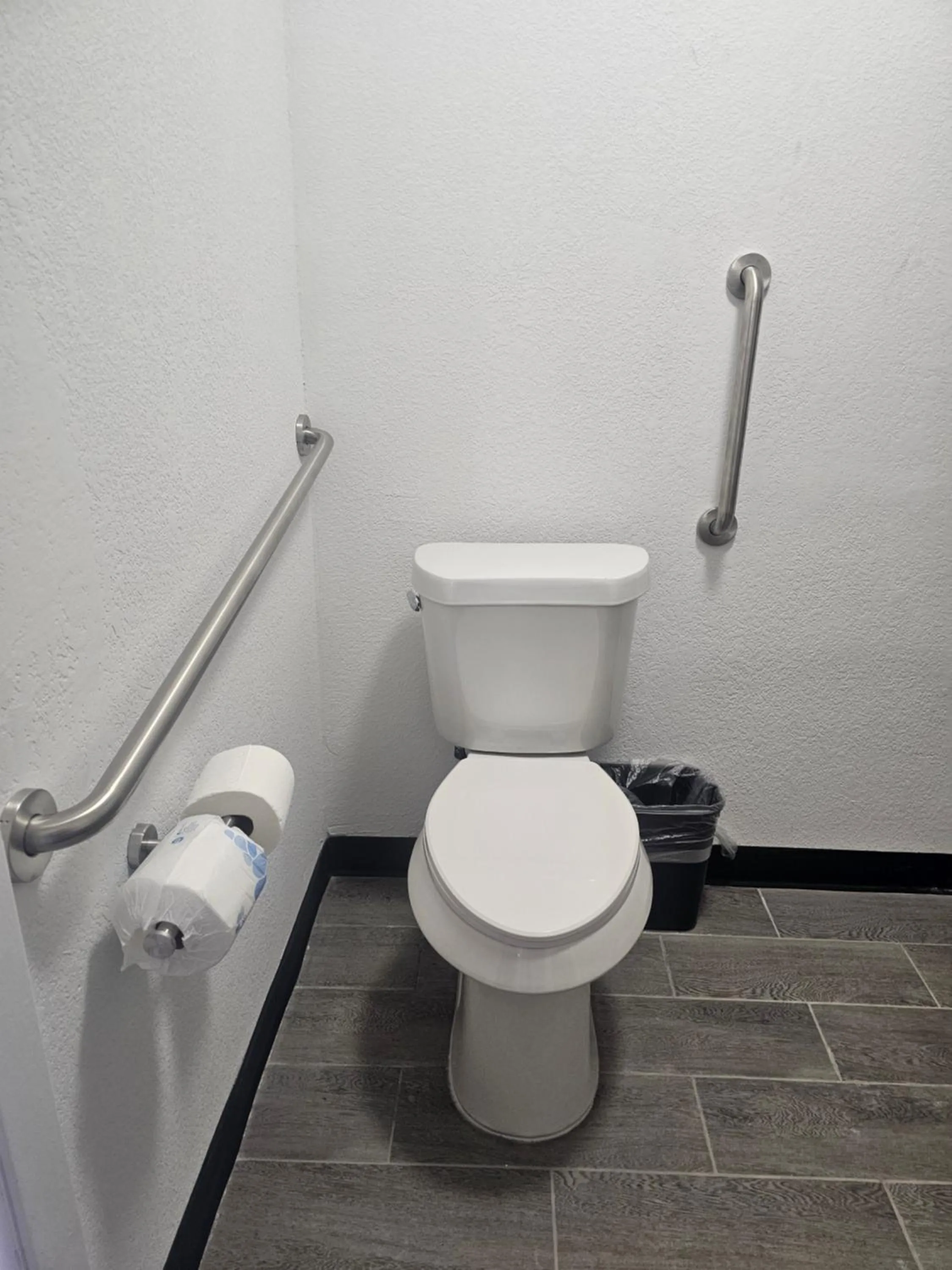 Toilet in Super 8 by Wyndham Hobbs