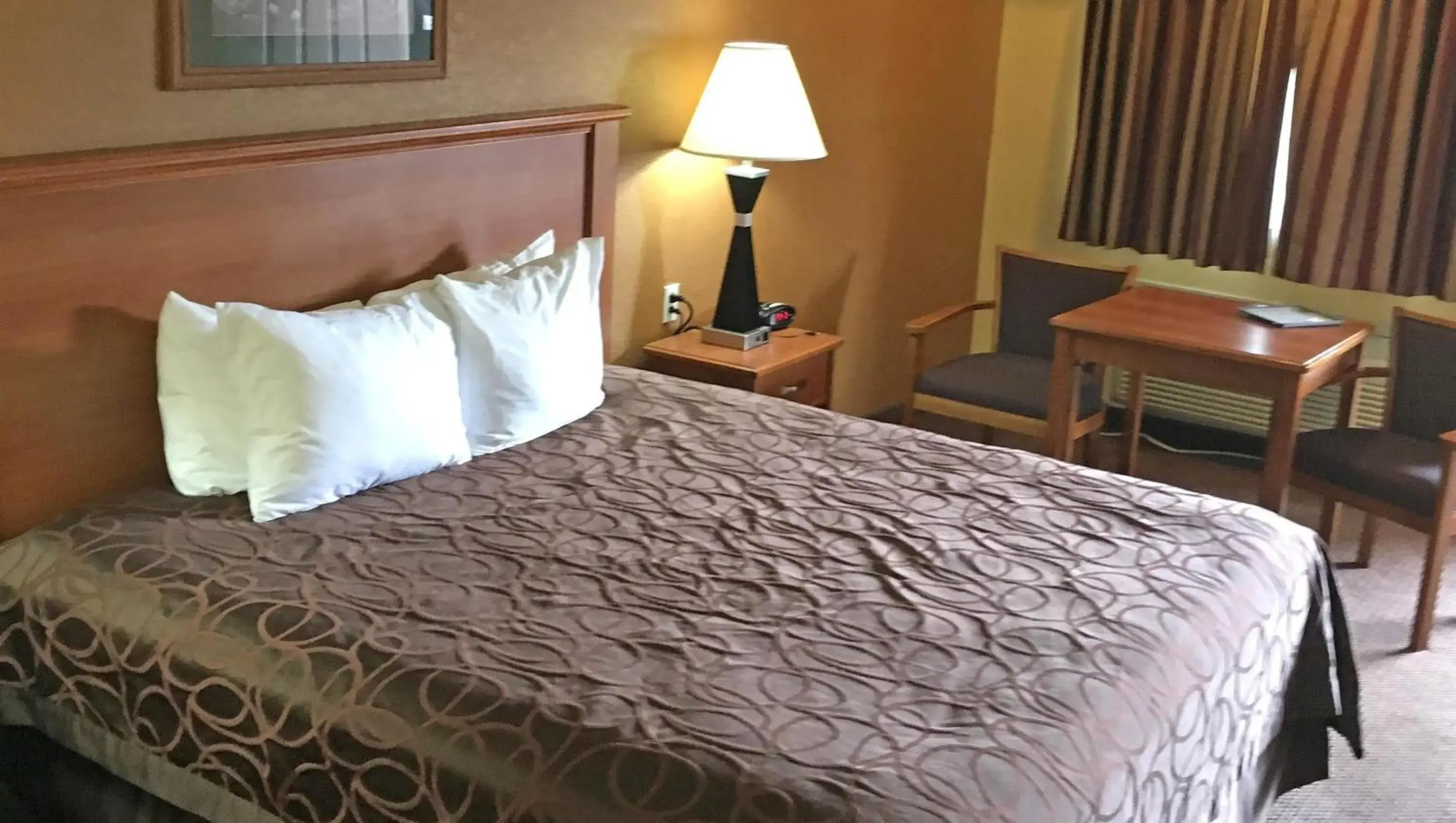 Bedroom, Bed in Xecutive Inn and Suites Bedroom, Bed in Xecutive Inn and Suites