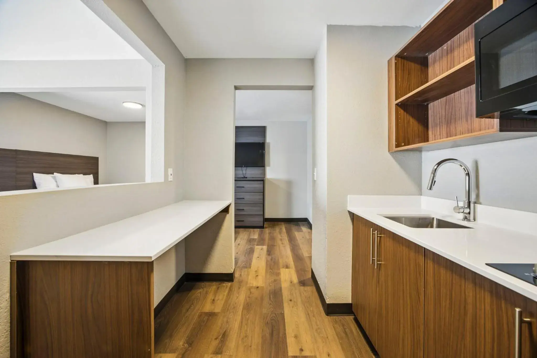 Kitchen or kitchenette in HomeStay Suites Kitchen or kitchenette in HomeStay Suites