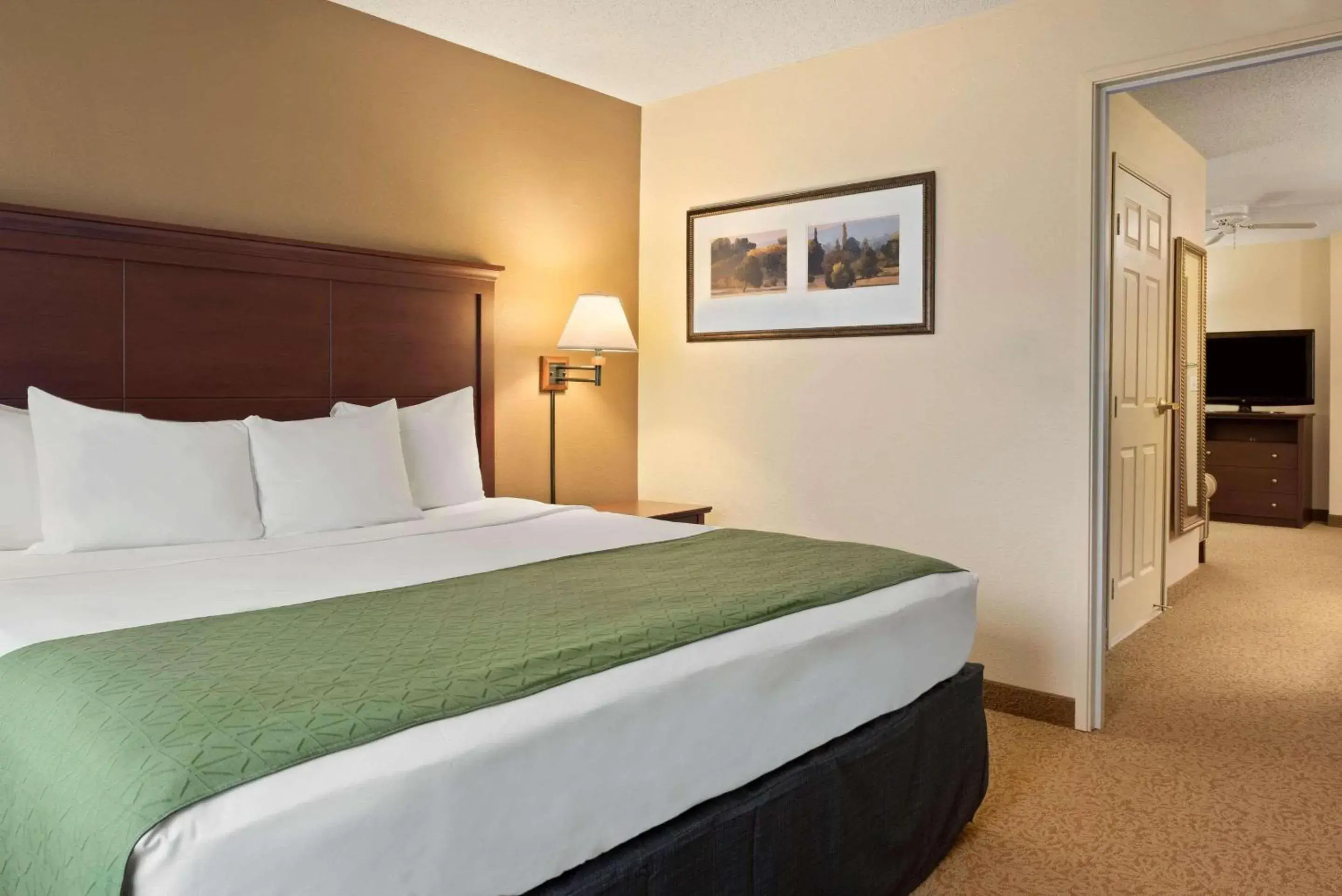 Bedroom, Bed in Country Inn & Suites by Radisson, Stevens Point, WI Bedroom, Bed in Country Inn & Suites by Radisson, Stevens Point, WI