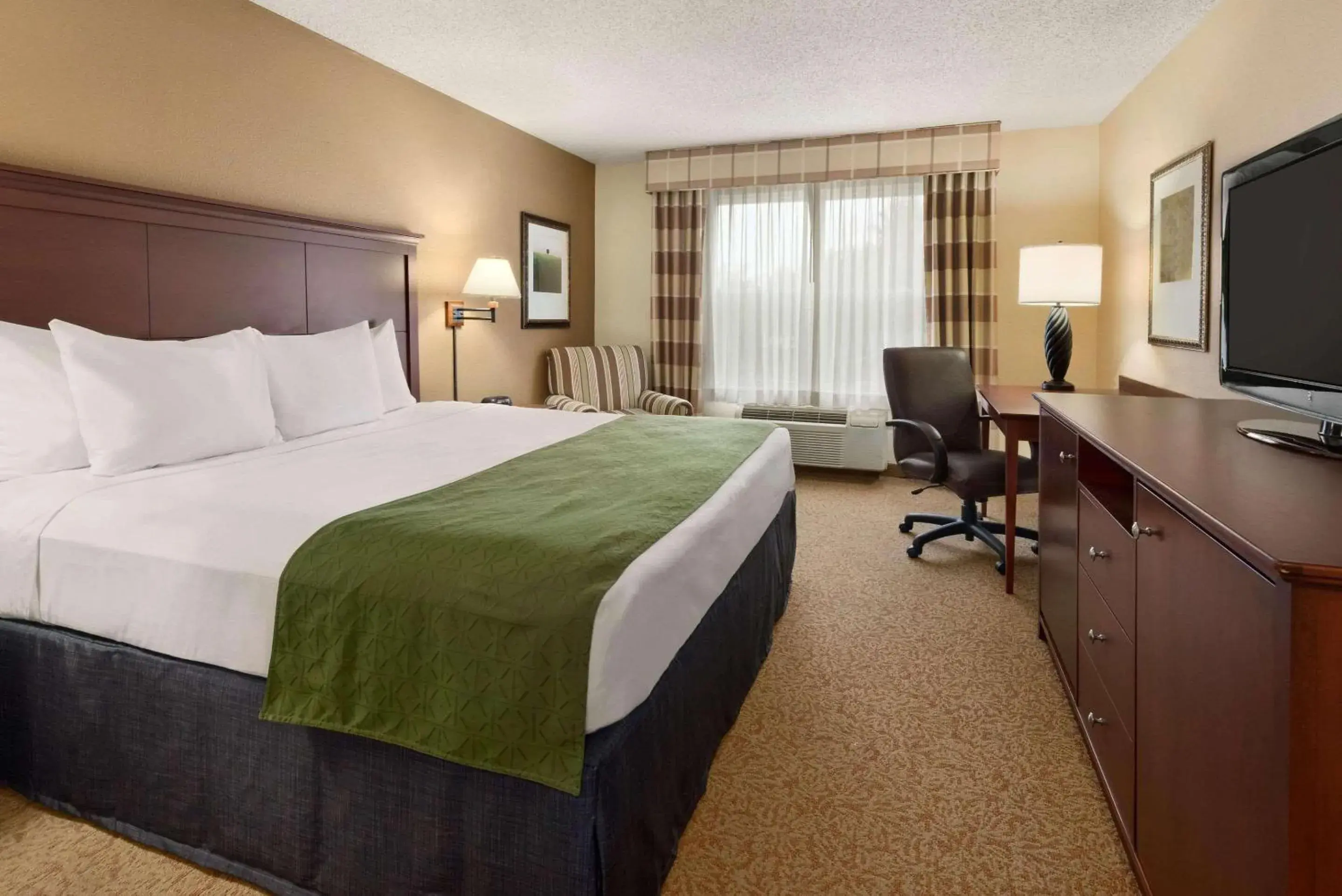 Bedroom, Bed in Country Inn & Suites by Radisson, Stevens Point, WI Bedroom, Bed in Country Inn & Suites by Radisson, Stevens Point, WI