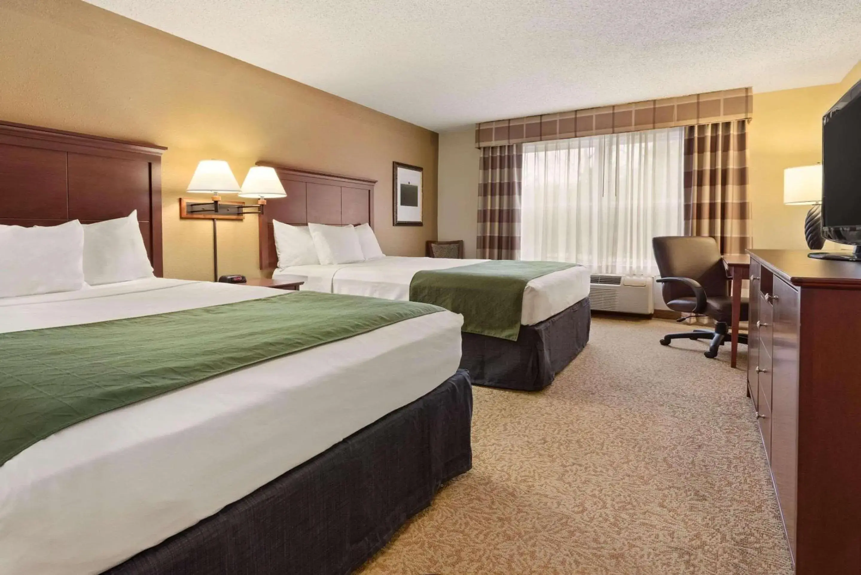 Bedroom, Bed in Country Inn & Suites by Radisson, Stevens Point, WI Bedroom, Bed in Country Inn & Suites by Radisson, Stevens Point, WI