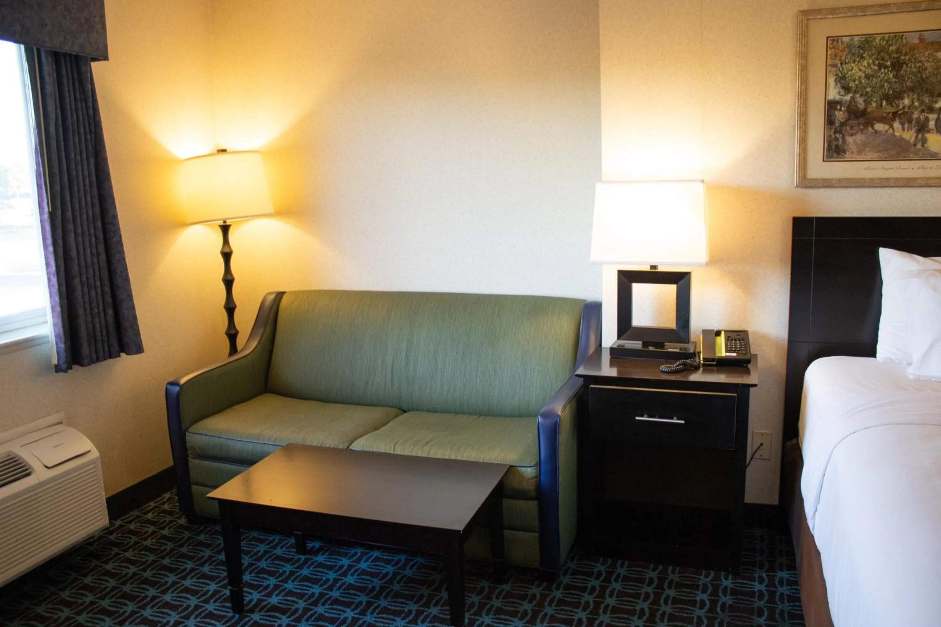 Seating area, Bed in Baymont by Wyndham Howell/Brighton