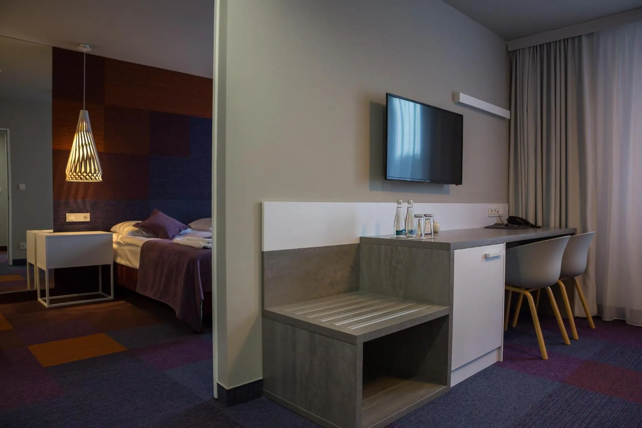 Bed in Hotel Quattro