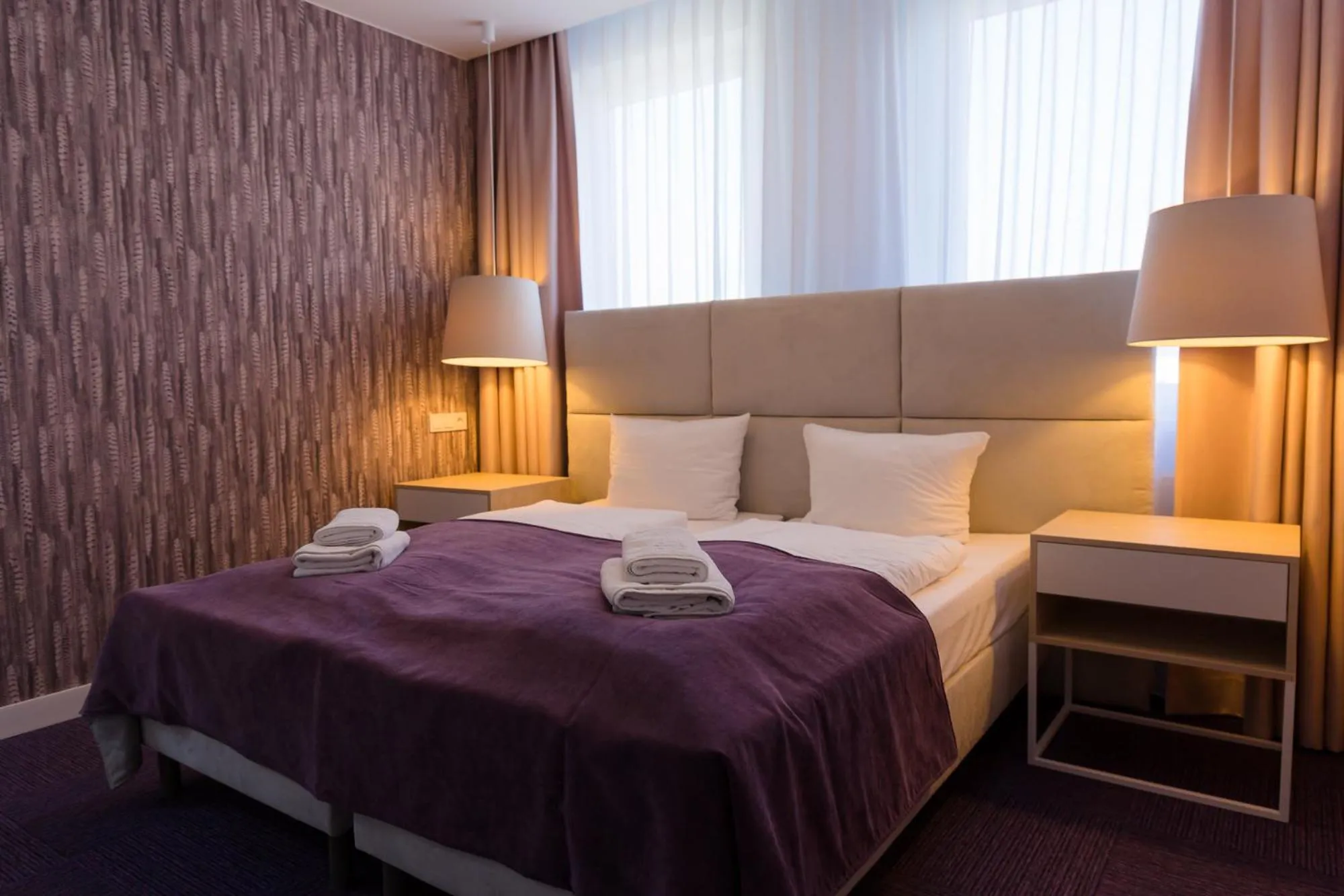 Bed in Hotel Quattro