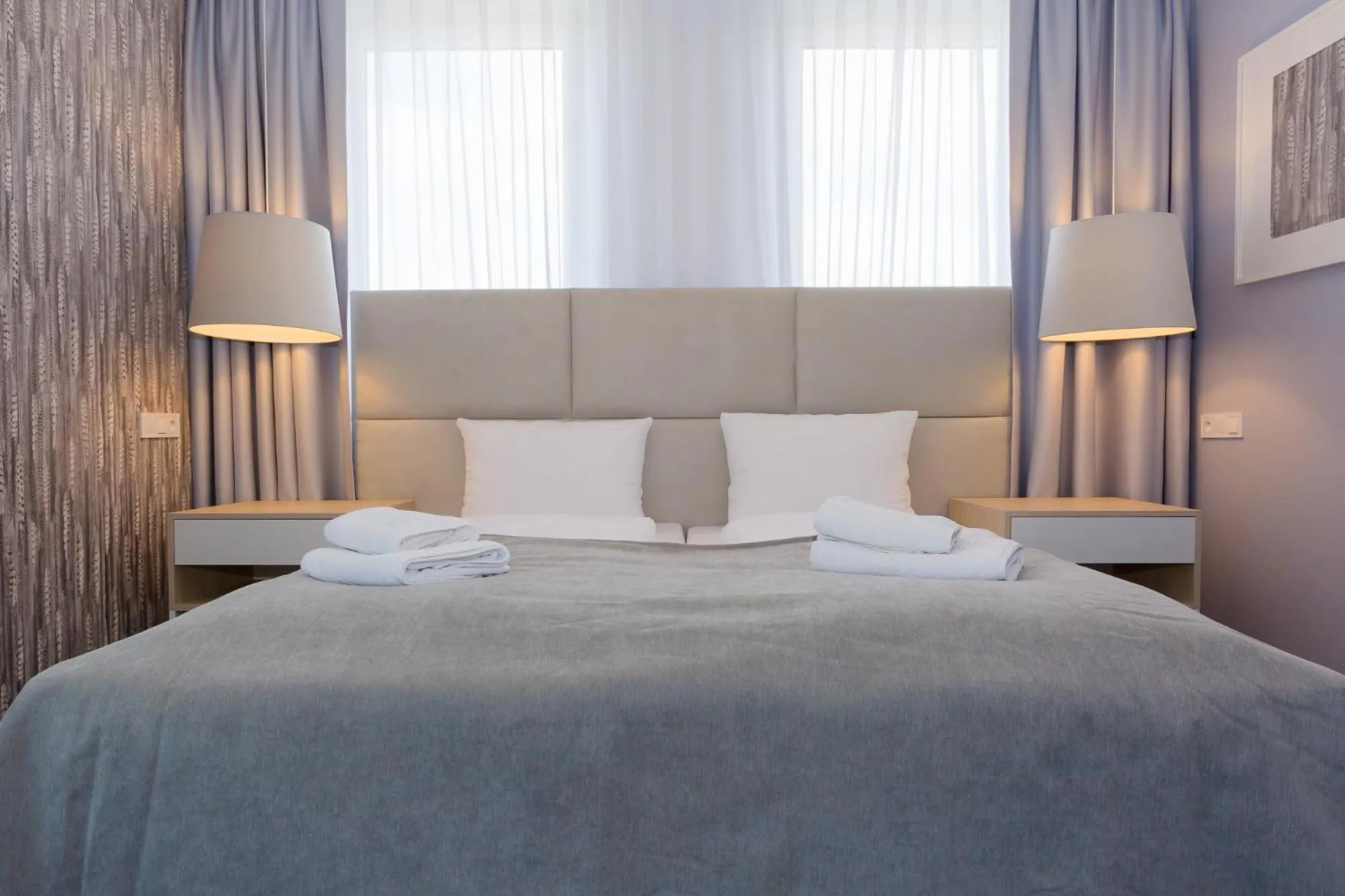 Bed in Hotel Quattro