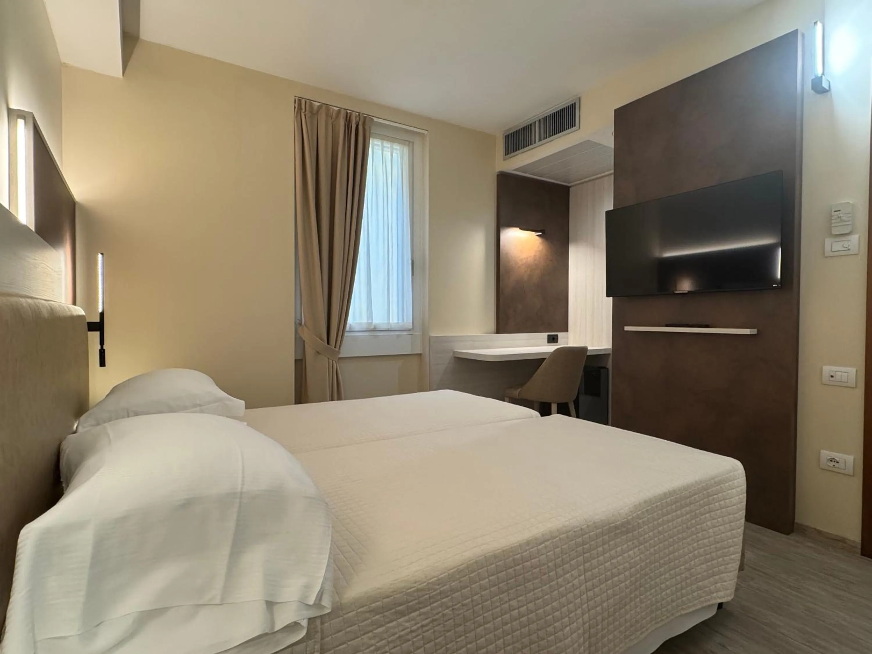 Bed in Hotel Roma