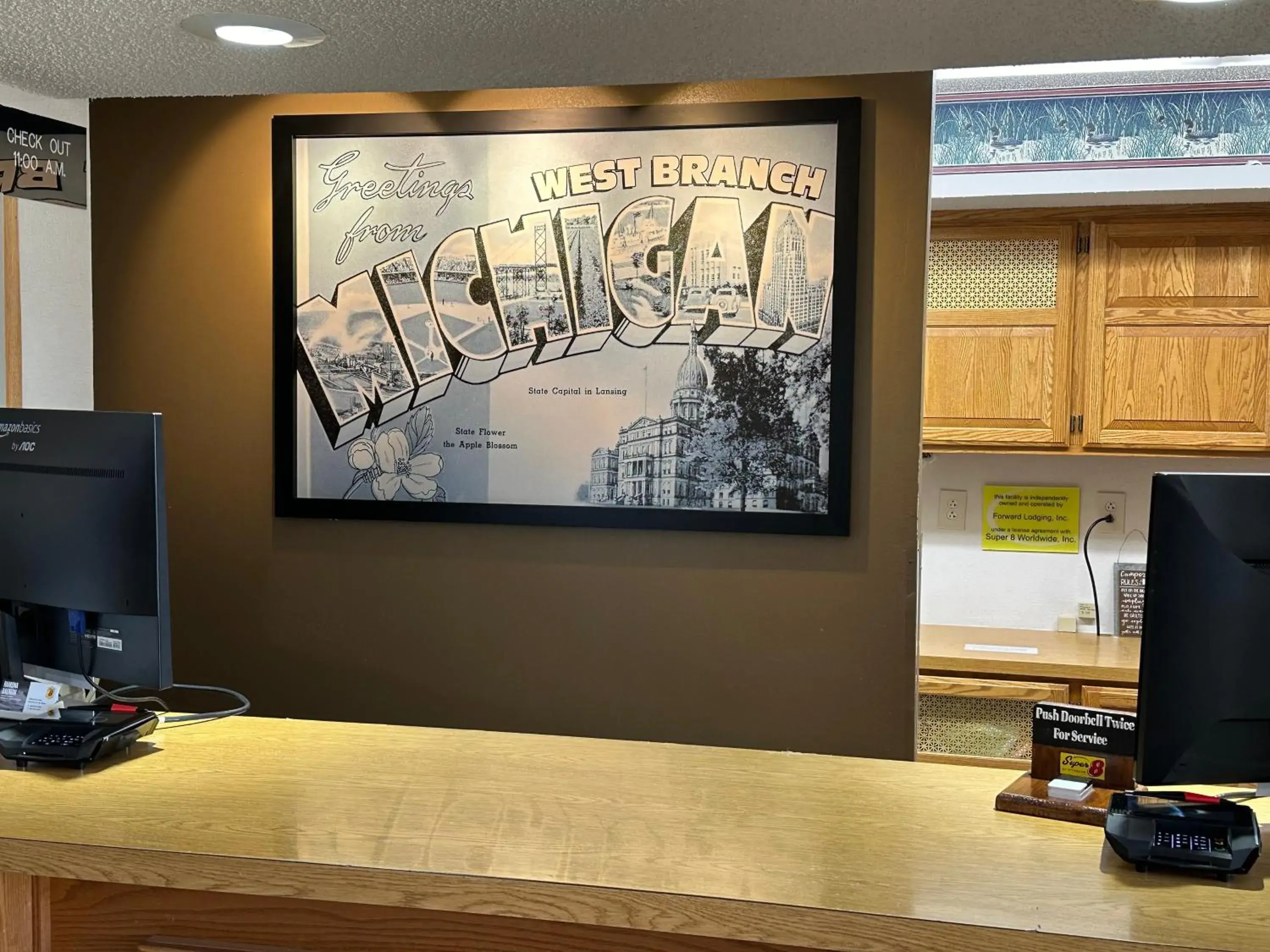 Lobby or reception in Super 8 by Wyndham West Branch Lobby or reception in Super 8 by Wyndham West Branch