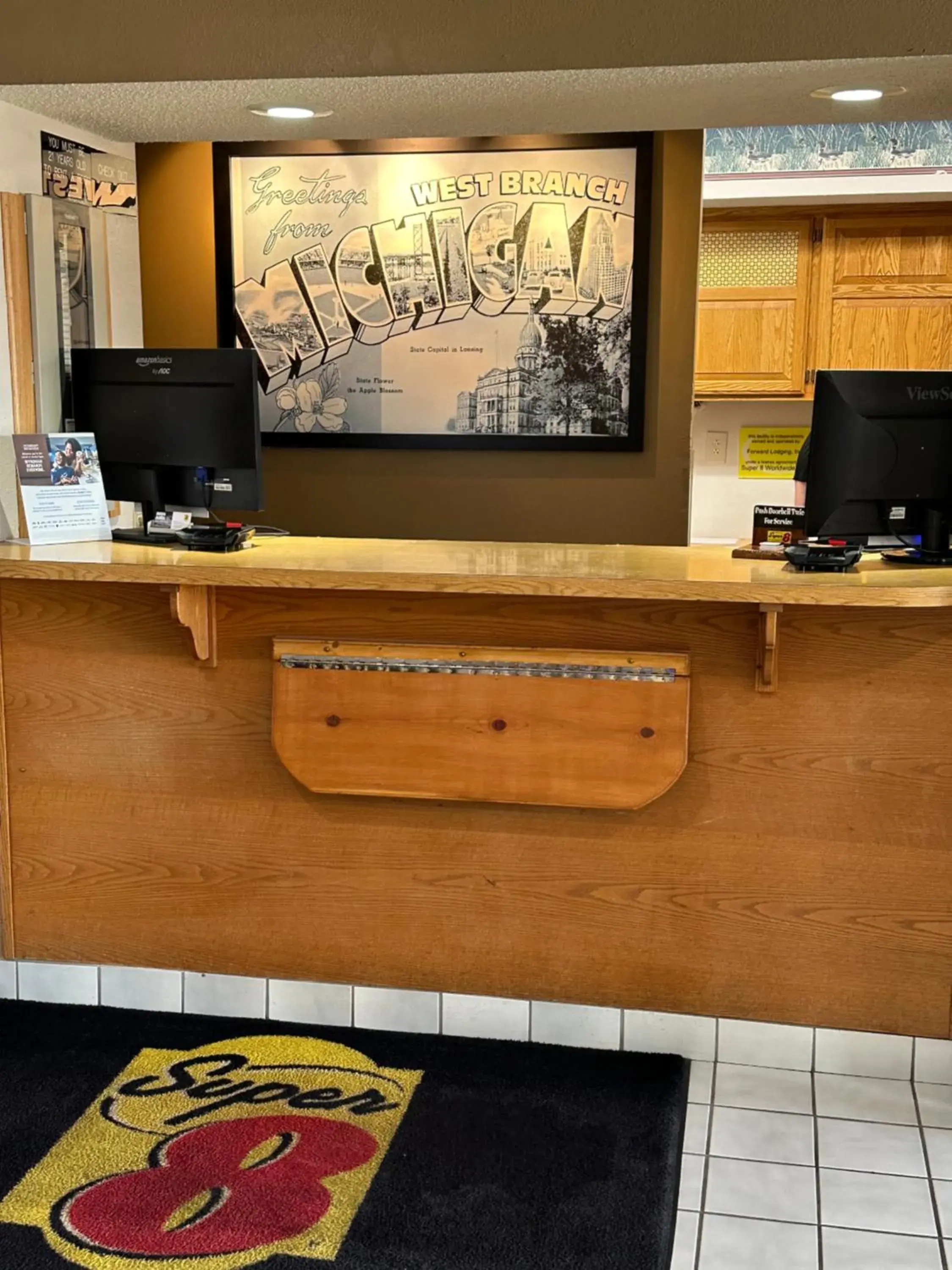 Lobby or reception in Super 8 by Wyndham West Branch Lobby or reception in Super 8 by Wyndham West Branch