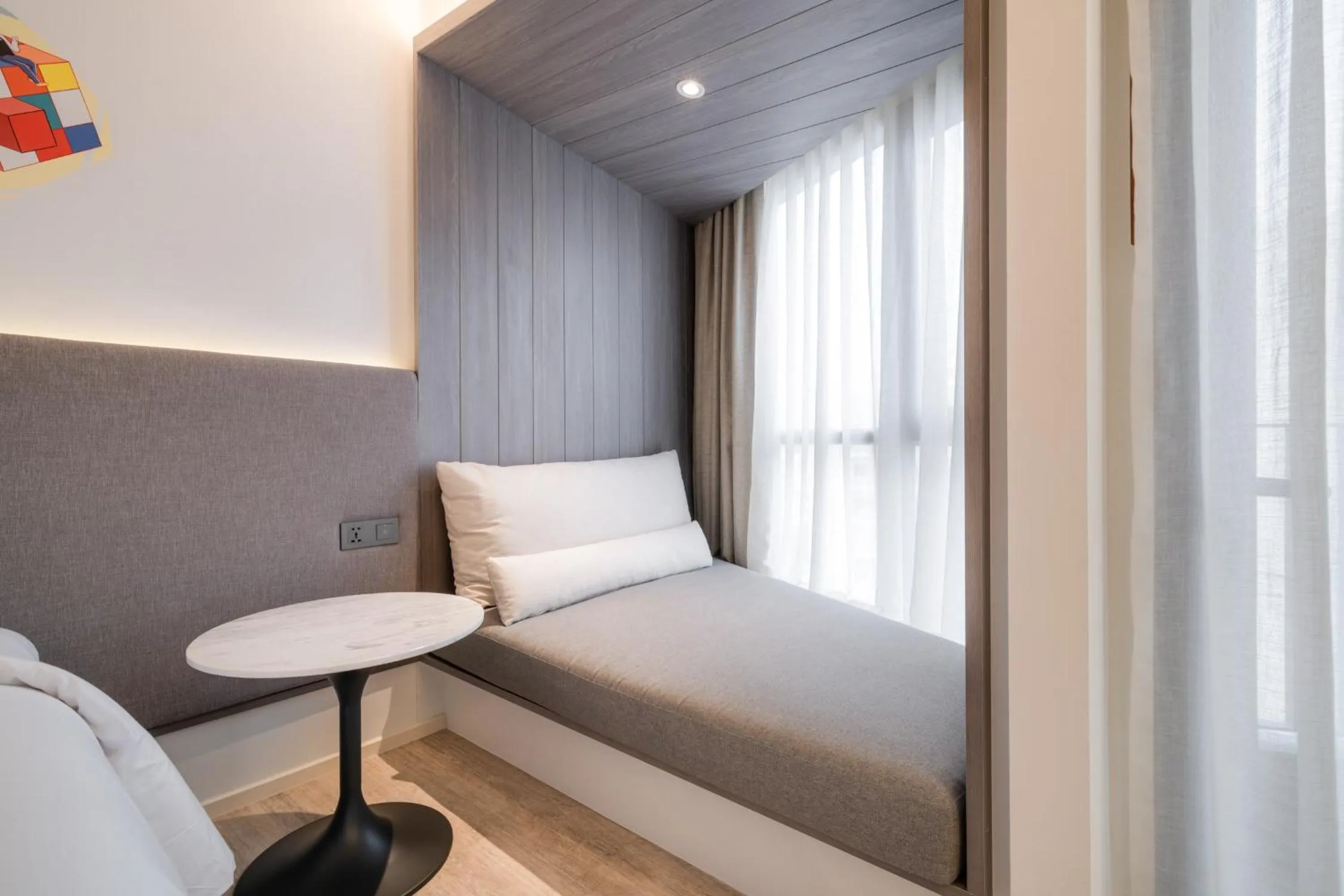 Seating area, Bed in Triple Y Hotel