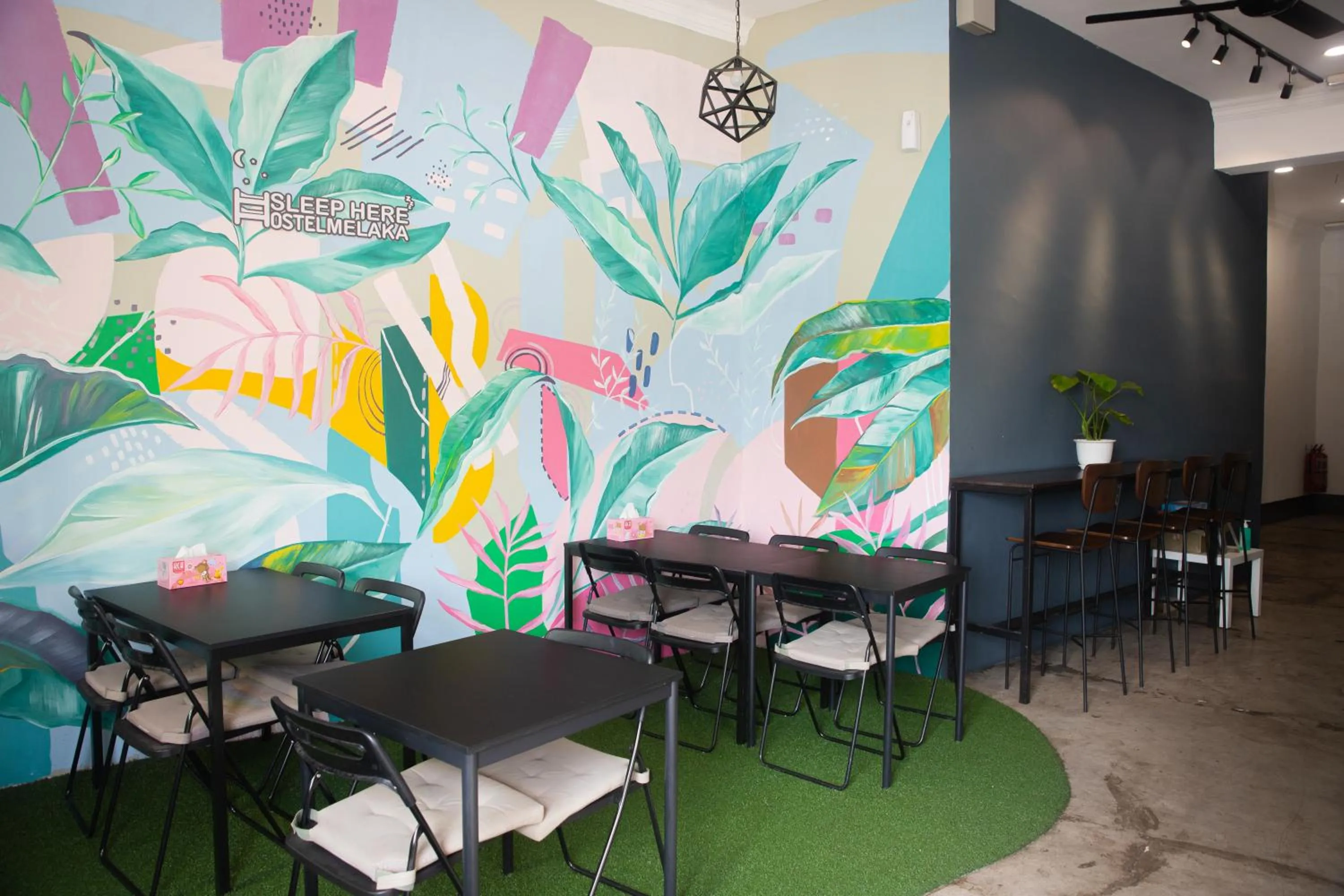 Communal lounge/ TV room in Sleep Here Hostel, Melaka