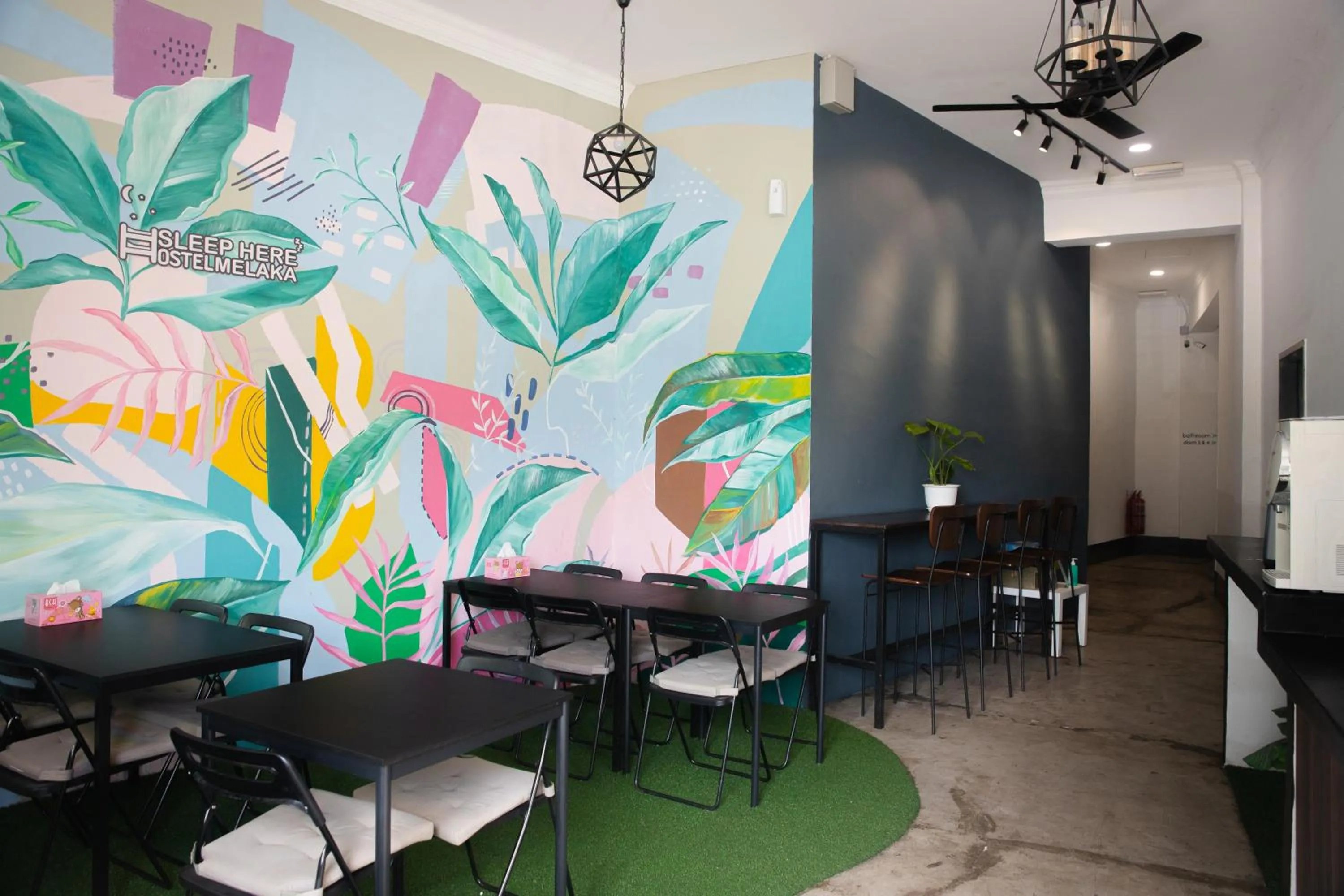 Communal lounge/ TV room in Sleep Here Hostel, Melaka