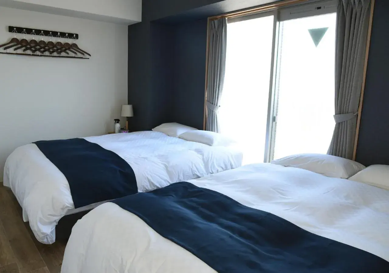 Bed in GLANZ KEI Kyoto Station Bed in GLANZ KEI Kyoto Station