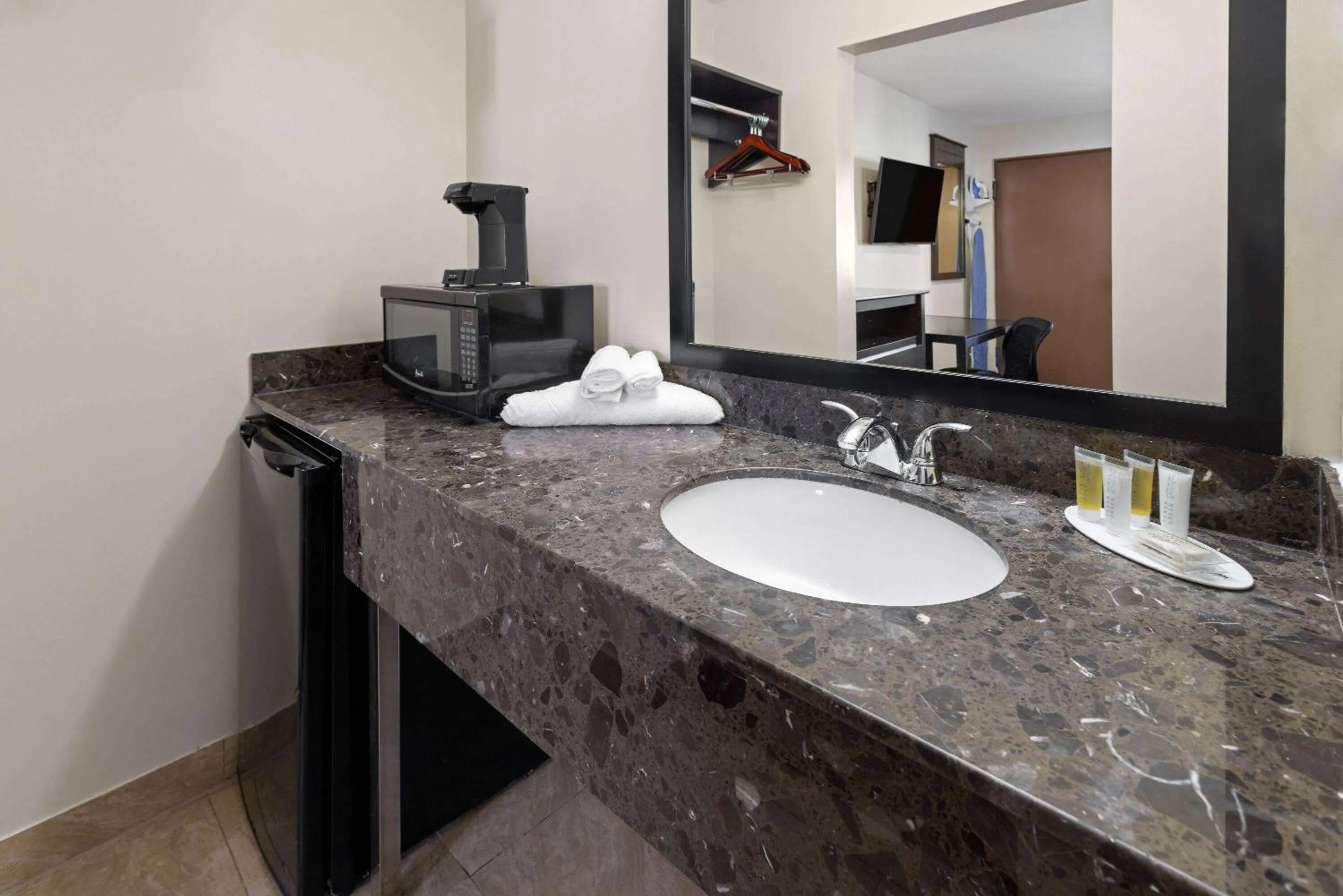 Bathroom in Travelodge by Wyndham Manhasset