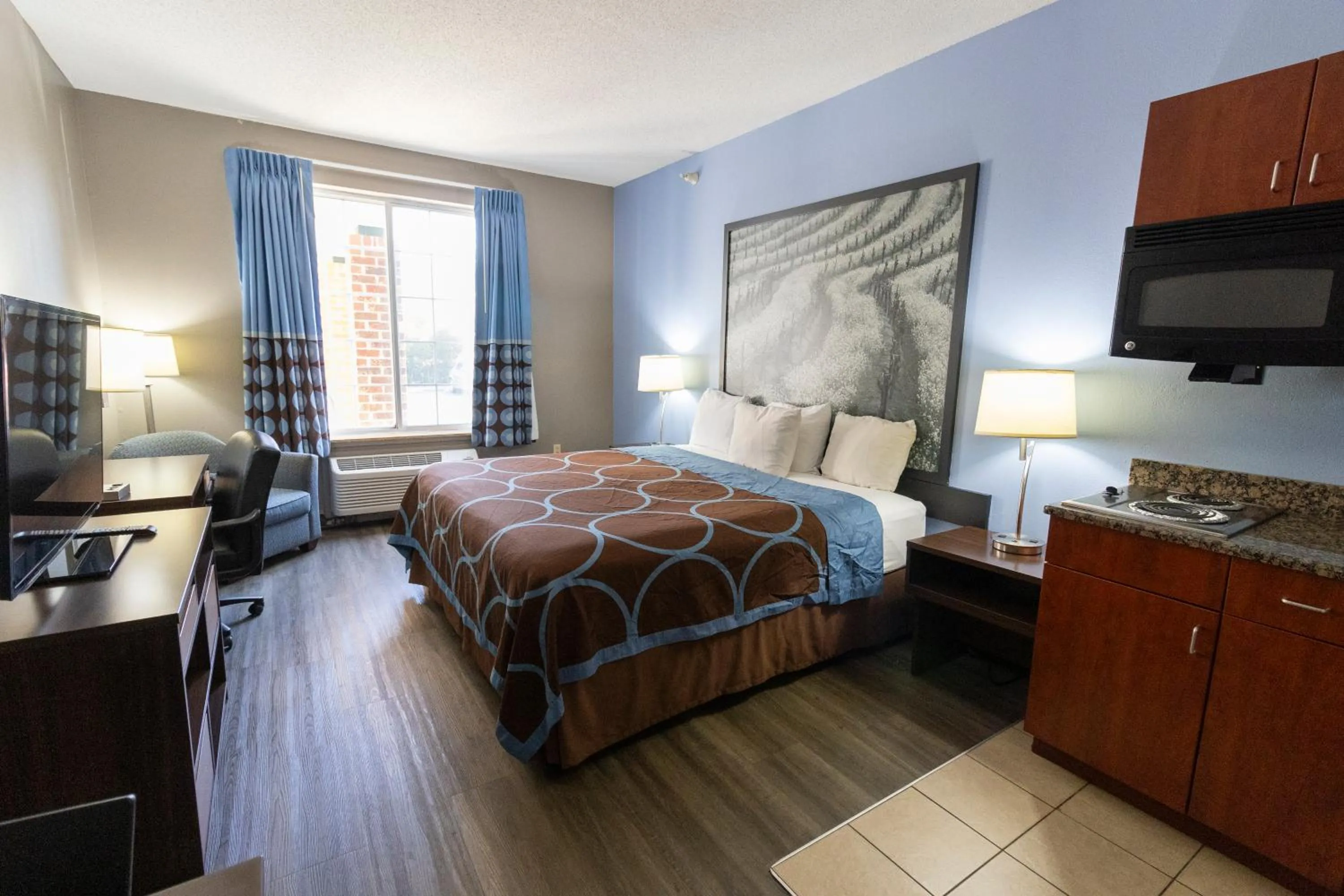 Communal lounge/ TV room, Bed in Super 8 by Wyndham Smithfield-Selma