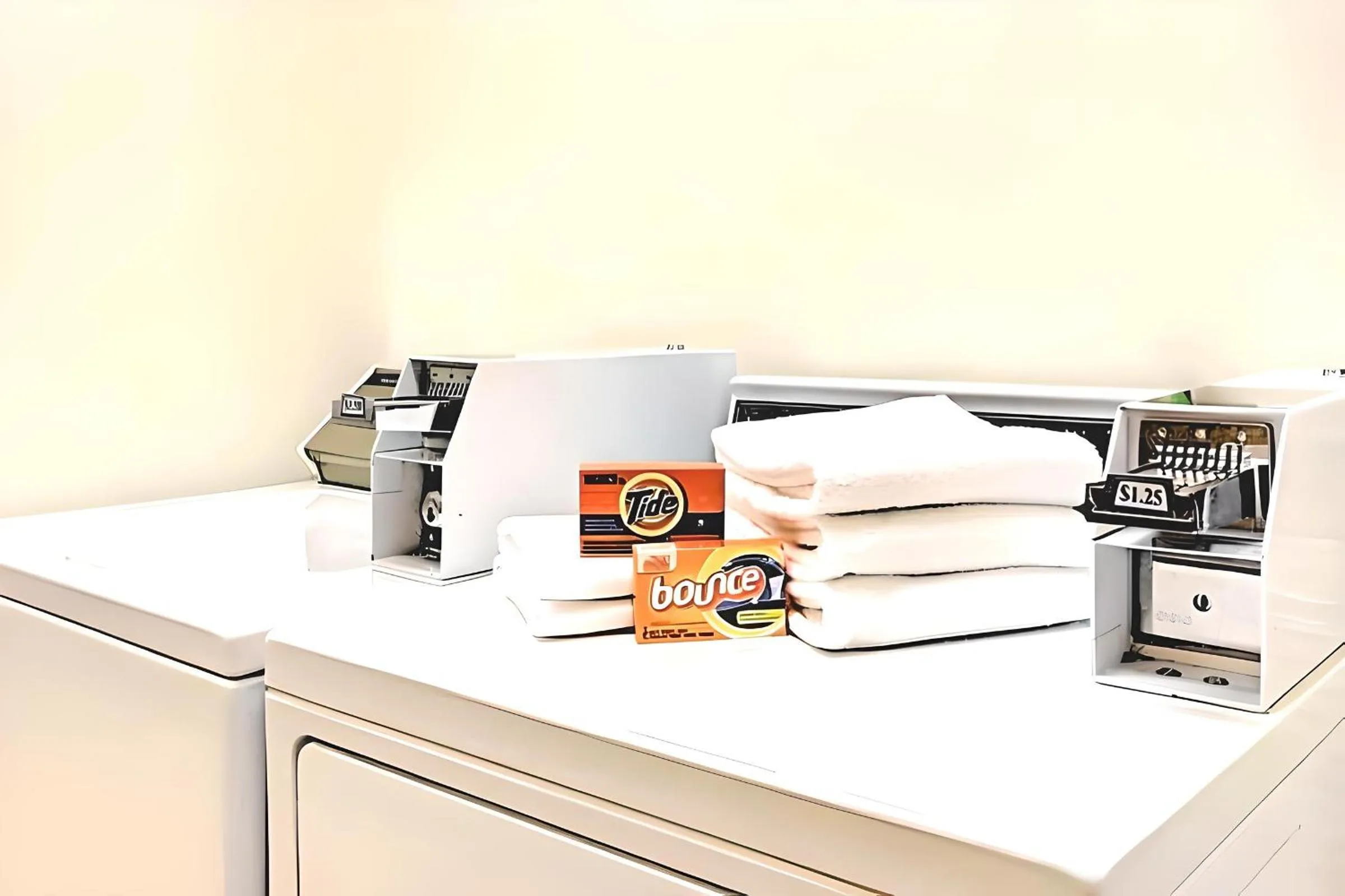 laundry in Super 8 by Wyndham Smithfield-Selma