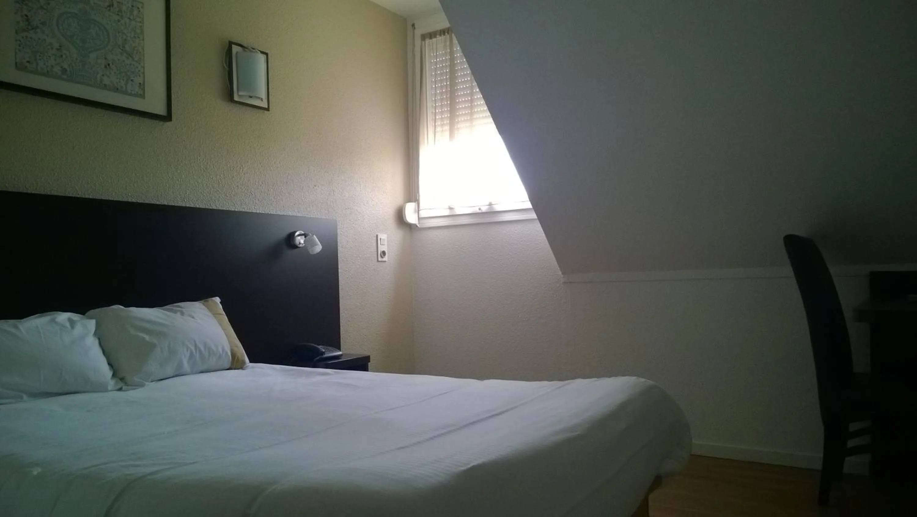 Bed in Hôtel d'Alsace