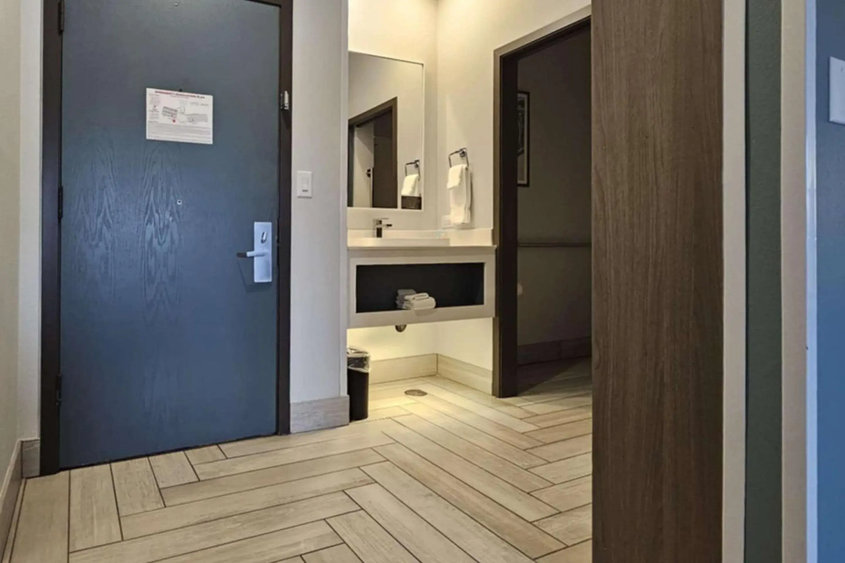 Bedroom in Edgewater Inn and Suites, an Ascend Collection Hotel Bedroom in Edgewater Inn and Suites, an Ascend Collection Hotel