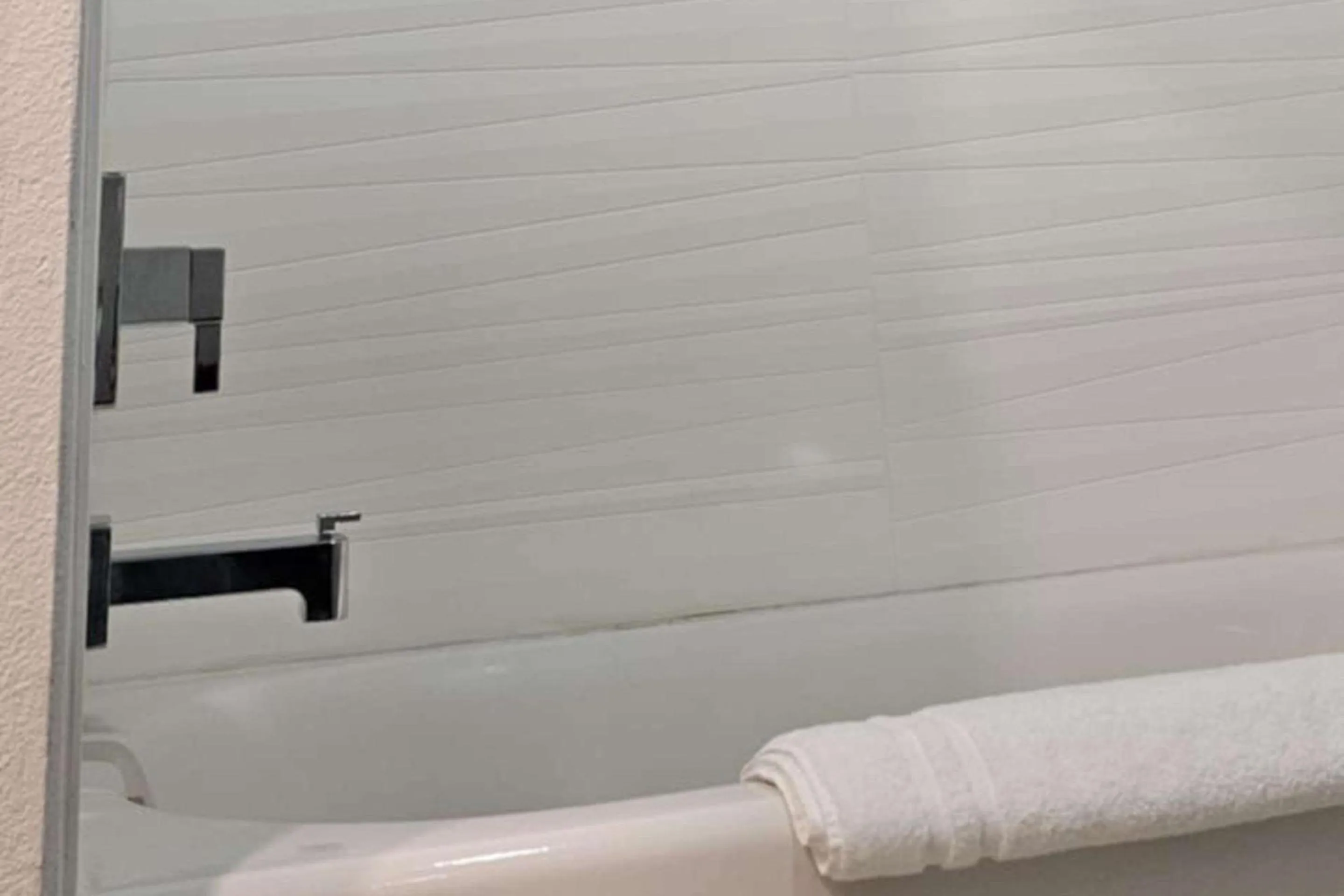 Bedroom in Edgewater Inn and Suites, an Ascend Collection Hotel