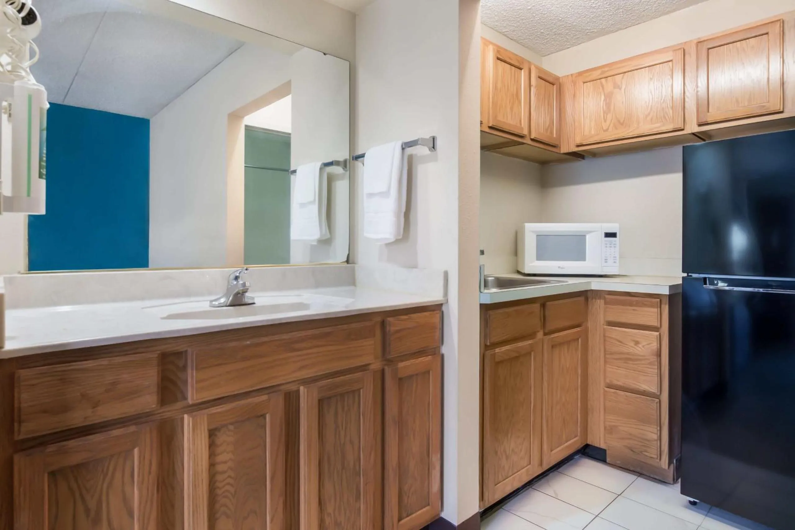 Kitchen or kitchenette in One life studio and suites