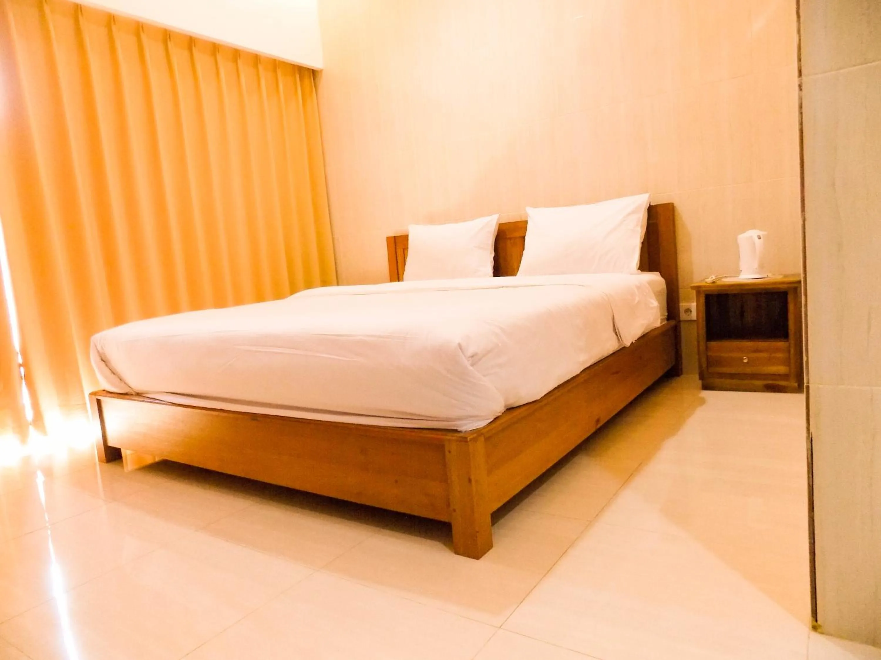 Bedroom, Bed in Guna Graha Kuta by Kamara