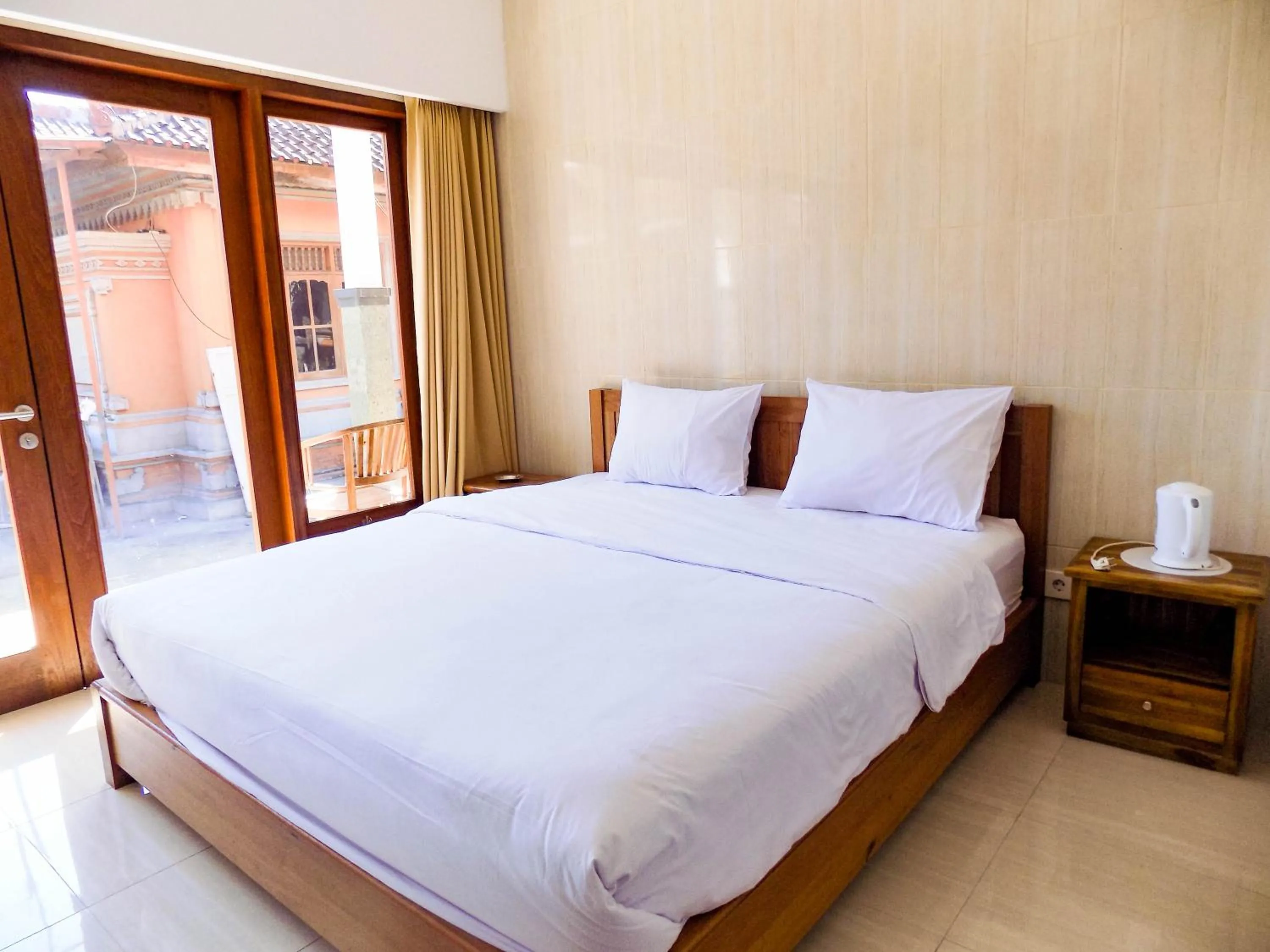 Bedroom, Bed in Guna Graha Kuta by Kamara