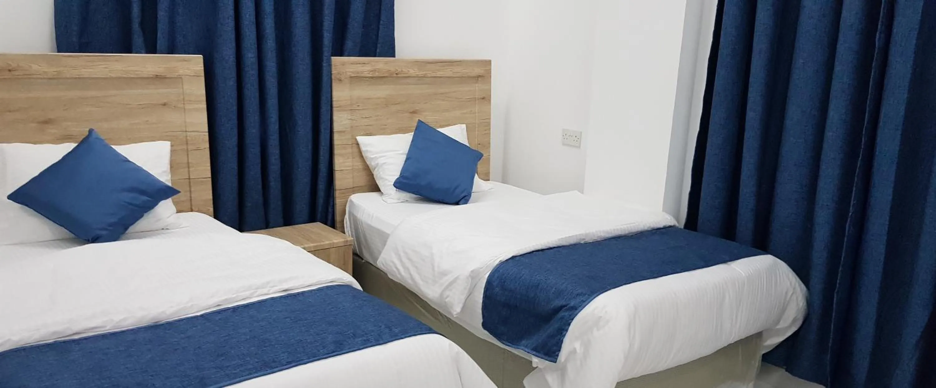 Bedroom, Bed in Duqm Suites
