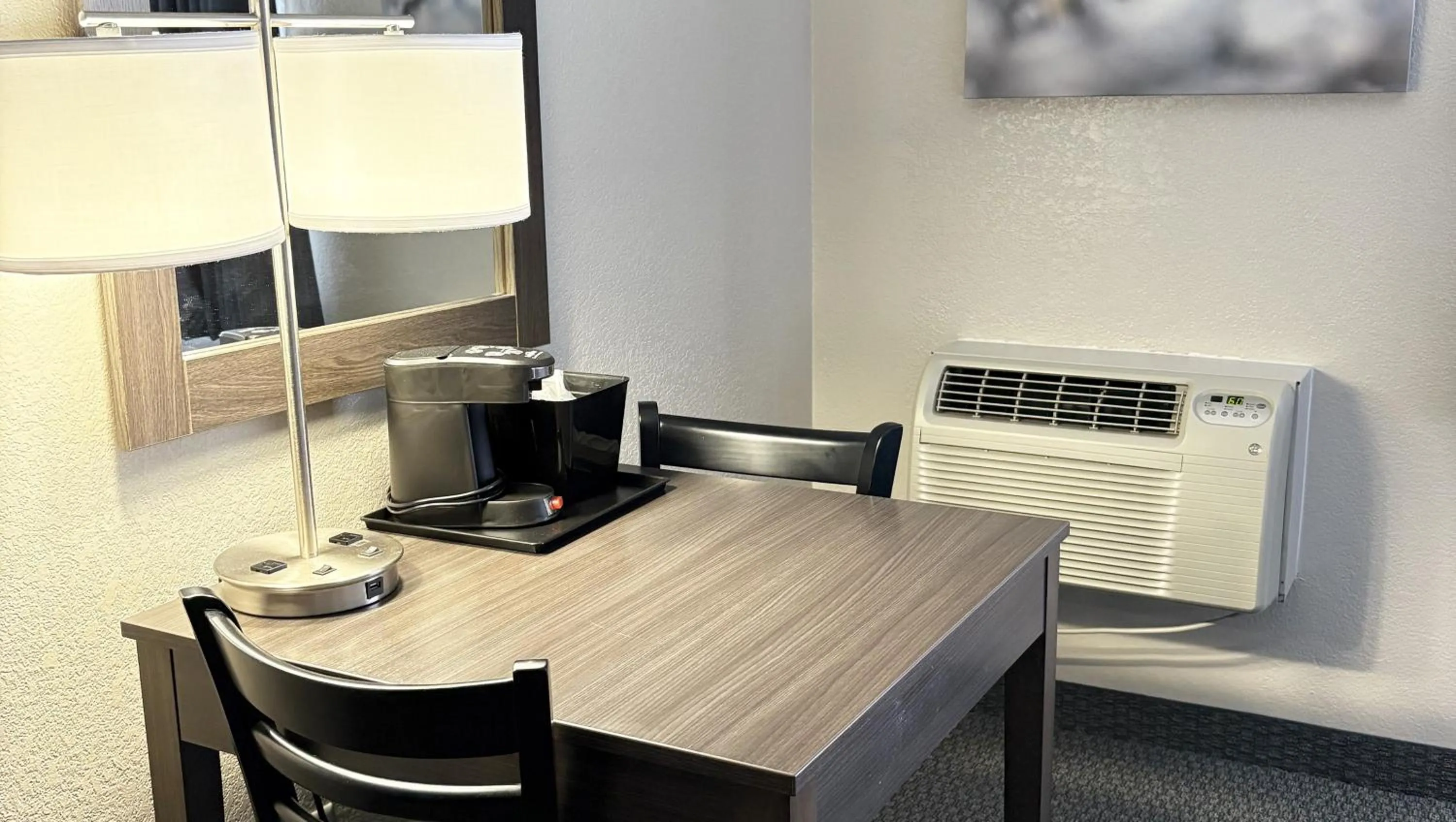 Bedroom in Magnuson Grand Pioneer Inn and Suites