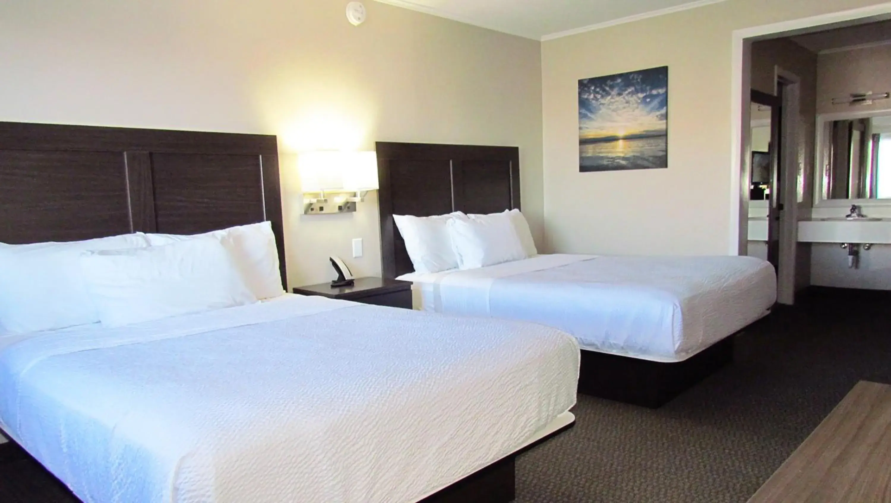 Queen Room with Two Queen Beds - Non-Smoking in Magnuson Grand Pioneer Inn and Suites Queen Room with Two Queen Beds - Non-Smoking in Magnuson Grand Pioneer Inn and Suites