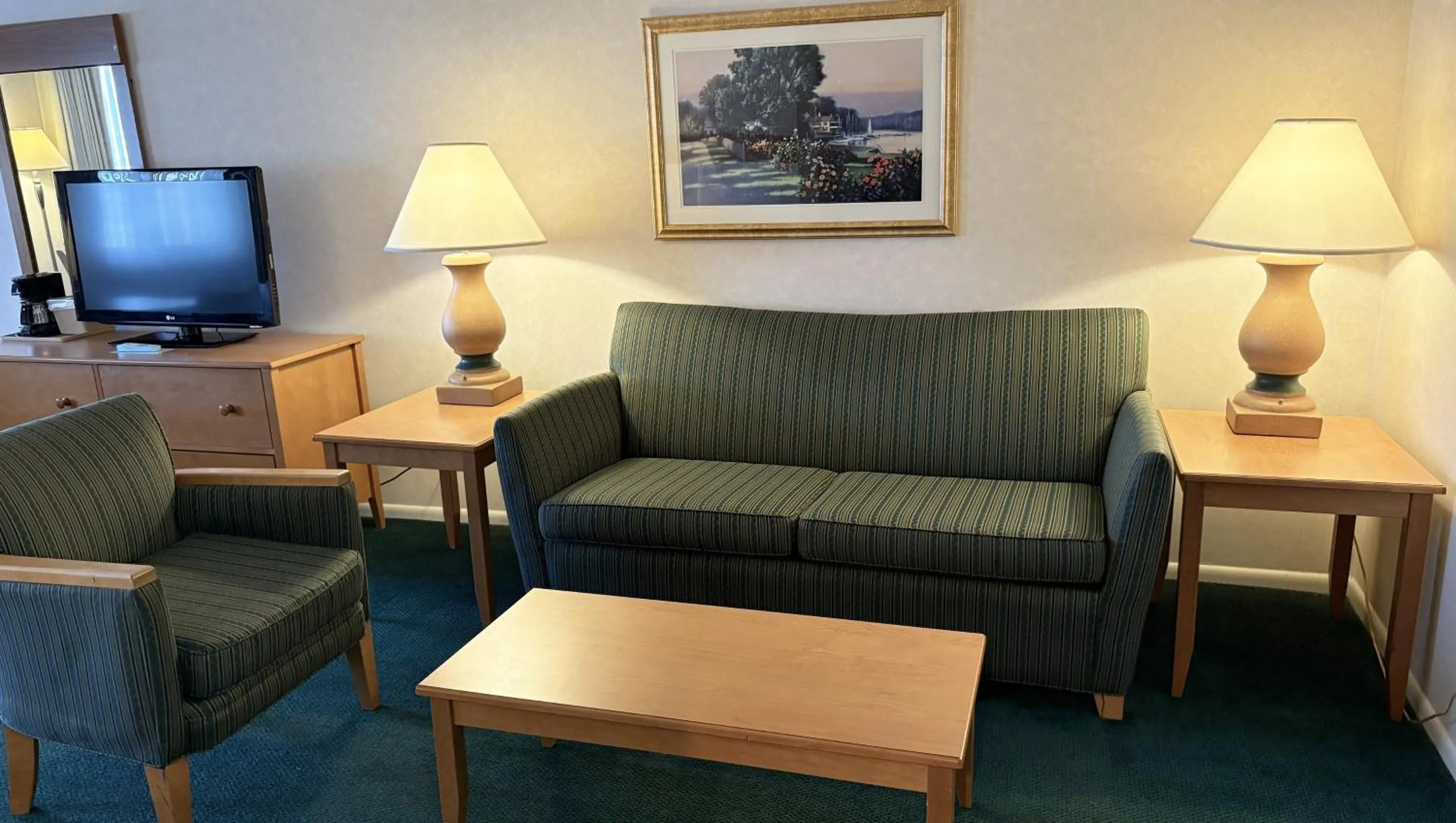 Bedroom in Magnuson Grand Pioneer Inn and Suites