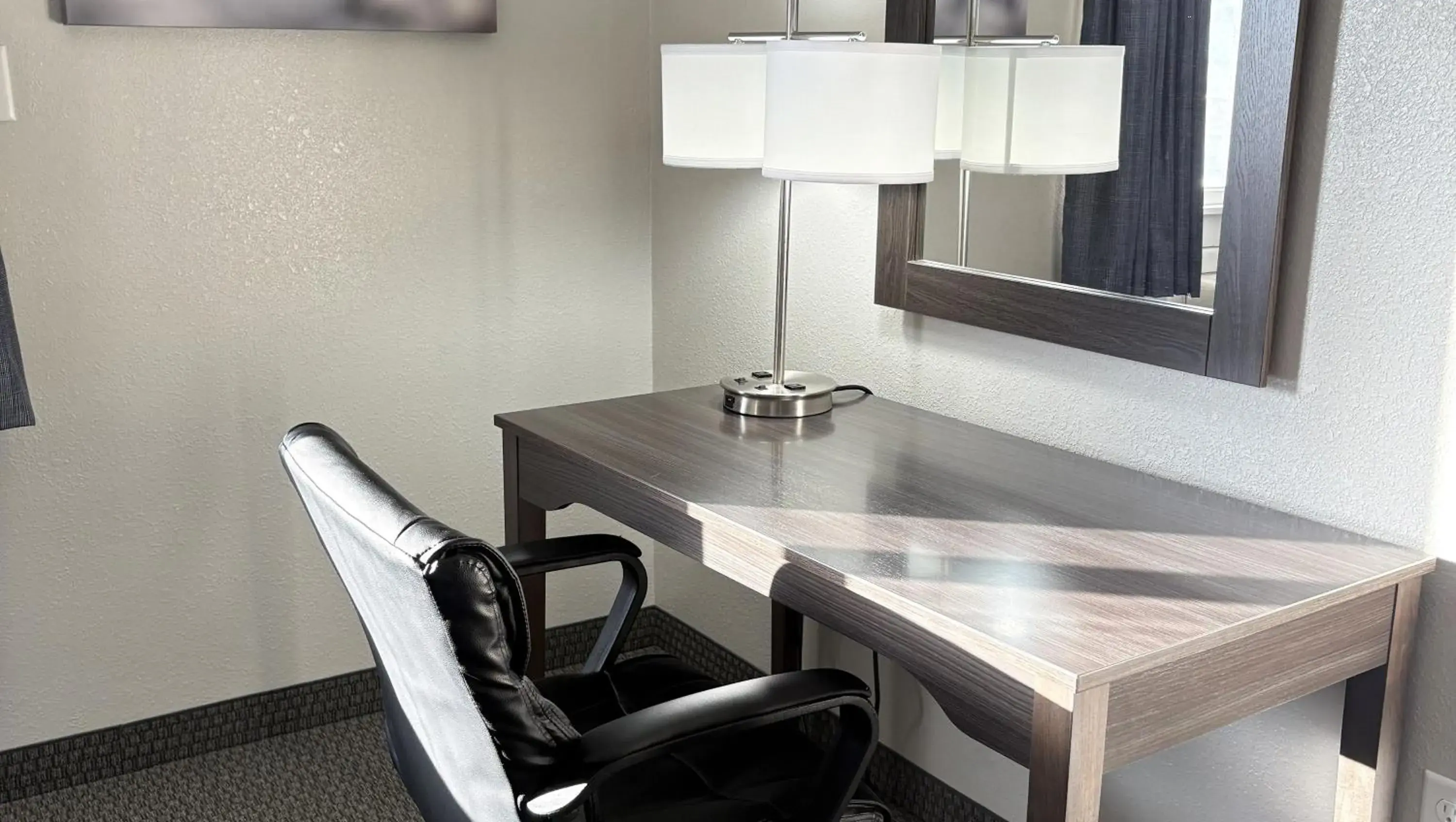 Bedroom in Magnuson Grand Pioneer Inn and Suites Bedroom in Magnuson Grand Pioneer Inn and Suites