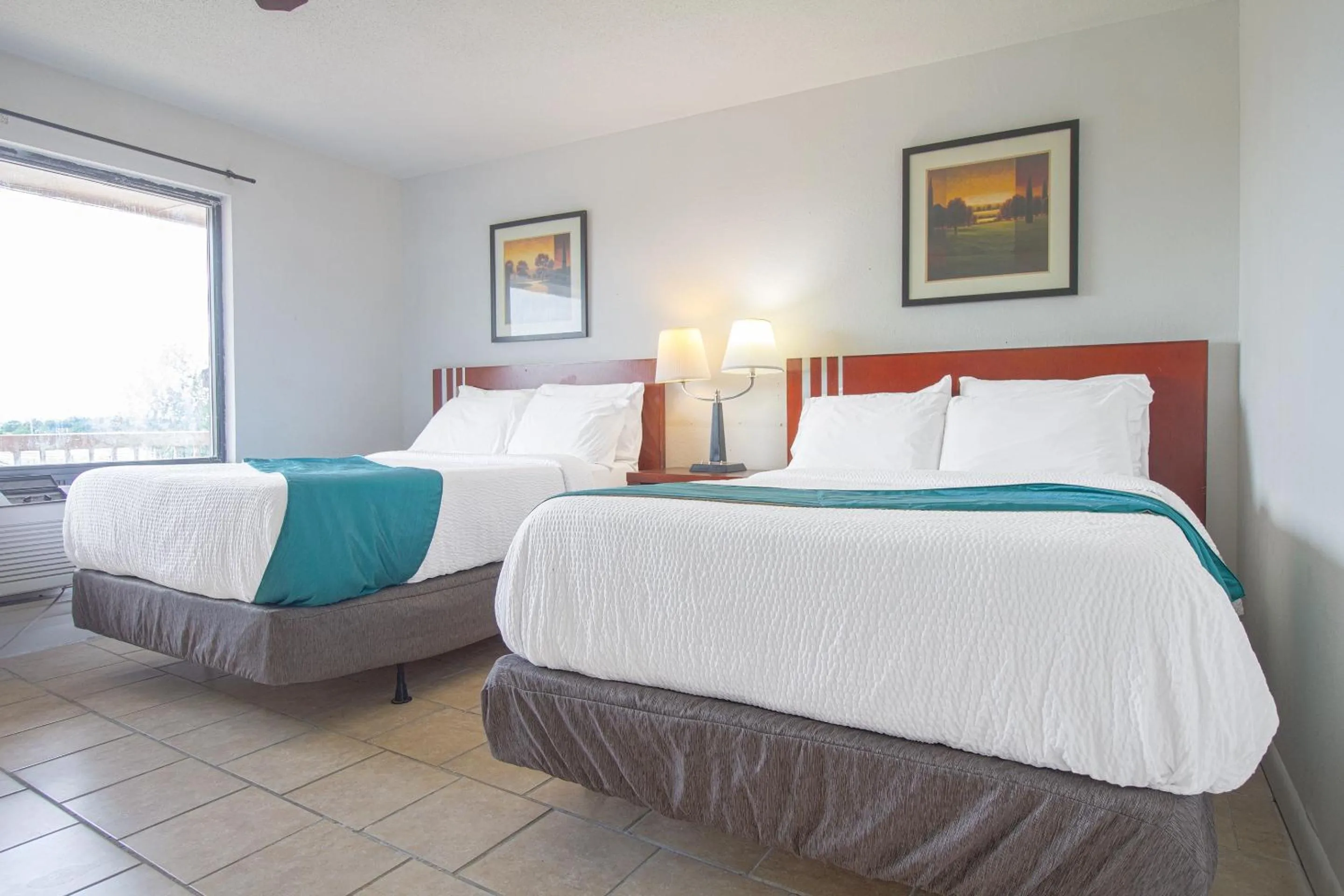 Bedroom in American Best Inn By OYO I-35 Perry near Lake McMurtry